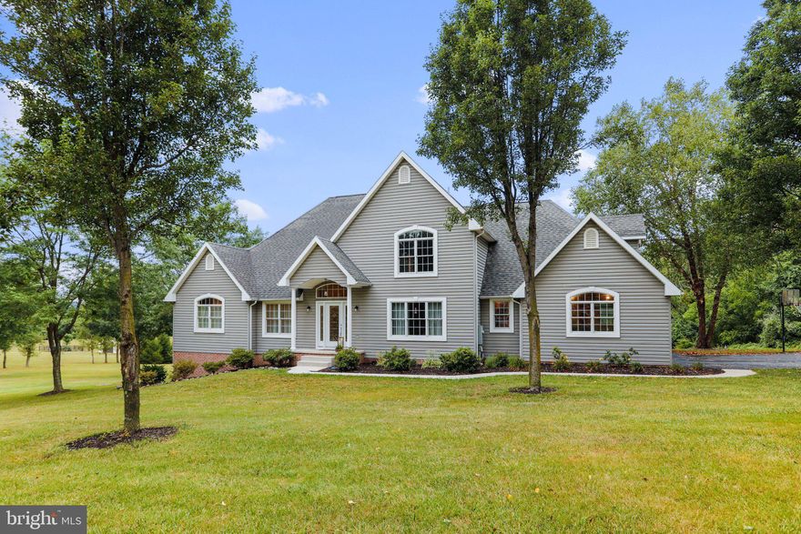 This 8-acre rural property is the perfect place to escape the hustle and bustle of city life. With trails for an ATV, scenic vistas, and proximity to the Rails Trails, you'll have plenty of opportunities to explore the great outdoors.

The property is a beautiful four bedroom, 2 and half bath home with a first floor Primary Suite.  As you enter the front door, you will be welcomed into a bright and sunny foyer flanked by a den, or hobby room, and living room.  Ahead of you is the casual family room and dining room.  The kitchen is perfect for entertaining and has enough counter space for the most scrutinizing of cooks.  Upstairs there are 3 secondary bedrooms with a bathroom and loft for relaxing.  

The property is also located just a short distance from the Western Maryland Rail Trail, which is a popular spot for hiking, biking, and cross-country skiing. The trail is a great way to explore the area and to get some exercise. The Rails Trails are a 27-mile paved trail that follows the old Western Maryland Railway line. 

If you are looking for a peaceful and secluded place to enjoy the outdoors, then this 8-acre property is the perfect place for you. Contact us today to schedule a viewing!