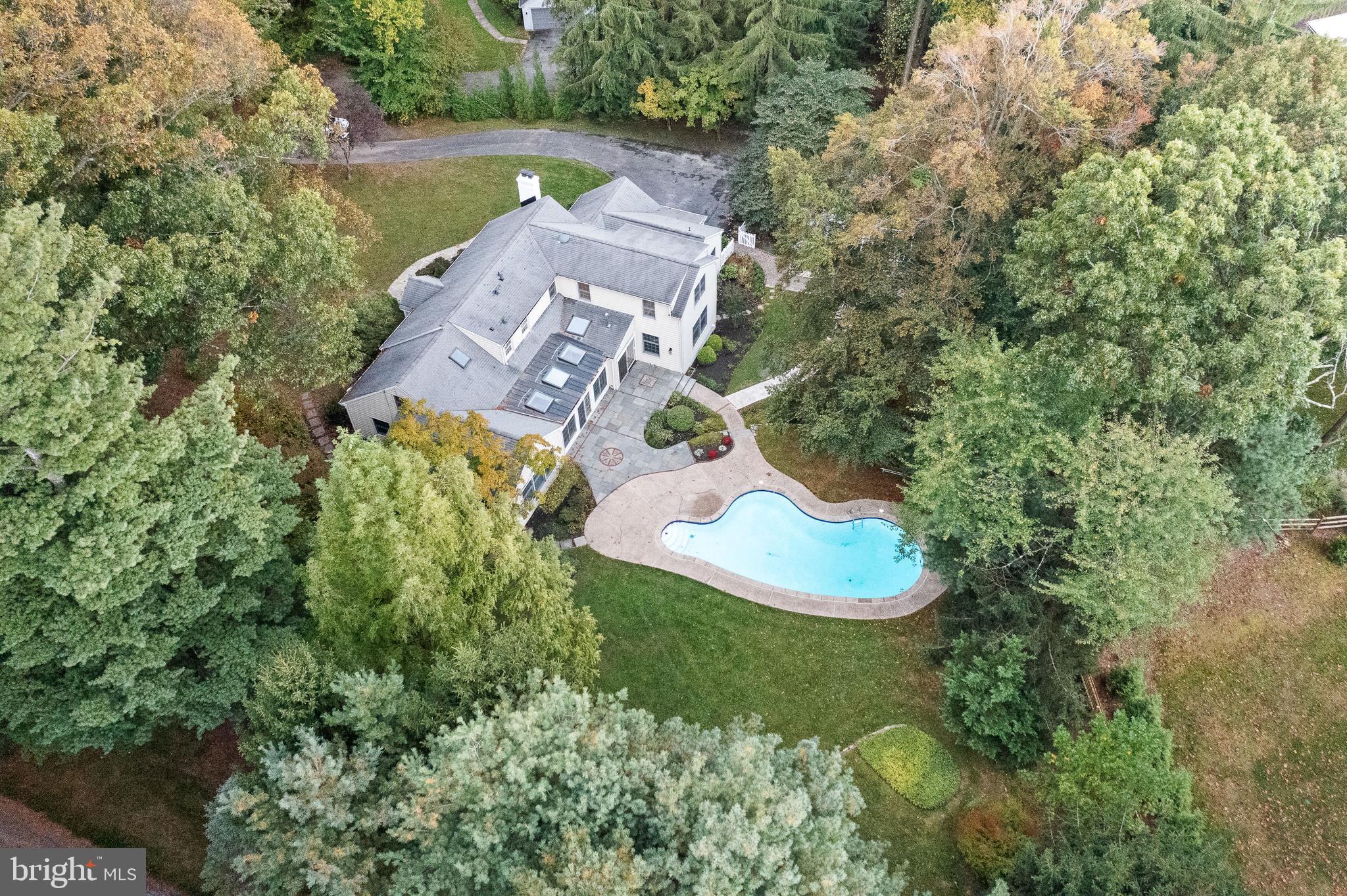 Come and enjoy this stunning completely renovated Cape Cod style home in the heart of Radnor Township. This spacious 3900sq ft plus home has so much to offer after undergoing a complete renovation. This beautiful home is nestled on almost an acre level lot in the Woodcrest neighborhood with a pool, separate hangout/pool house with exposed wood beams, ample sitting areas both around the pool and on the large paver/flagstone back patio. As you enter the home you will find a gracious living room with hardwood floors and a stone façade fireplace. This chef inspired kitchen is every cooks dream complete with Café Professional series appliances and a Fisher & Paykel refrigerator. The honed marble backsplash highlights the beautiful white cabinetry and quartz countertop, and the butler bar has ample counter space, a beverage refrigerator, and a bar sink. The light filled main family room has access to the year-round sunroom that overlooks the beautiful backyard and pool. The side entrance gives you access to a mudroom, garage, and a beautiful laundry room with ample storage. The first-floor primary bedroom has a beautiful sitting room that overlooks the backyard and has access to the year-round sunroom. The primary bathroom is beautiful with a free-standing tub, double vanity, and a large shower. This primary suite is complete with his and hers walk in closets. On the main level you will find 2 additional bedrooms and or an office and a full bathroom with access to the outside pool area. The second level has a 2nd large primary suite with an ensuite bathroom with a floating double vanity and large shower. The custom walk-in closet has ample space for both his and hers. Two more bedrooms and a hall bathroom complete the 2nd floor. The lower level has an additional 600 plus sq ft of finished space. With its luxury plank vinyl floors and a reeded wall complete with TV/Cable hook up it’s the perfect space to hangout. A whole house backup generator was installed in 2020. This 5/6 bedroom, 4 bath home is in the award-winning Radnor School district. and is close to Villanova, the train, major highways, and a quick drive to downtown Wayne with local shops and restaurants.