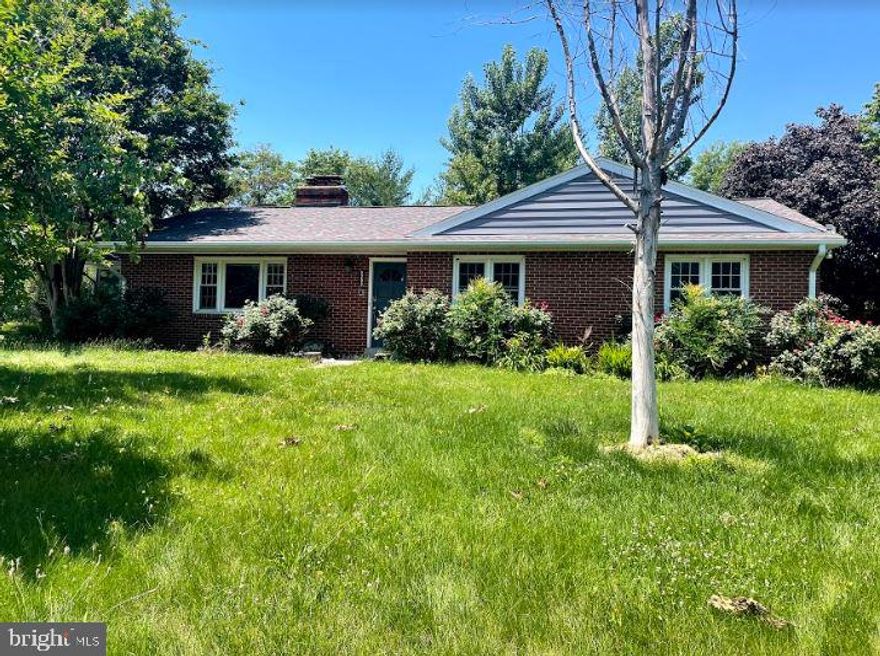 Charming brick and stone front Ranch style home in Maple Grove Estates on a beautiful green lot surrounded by flowering bushes and Features 3 bedrooms and 2 full bathrooms. Light and bright living room with cozy wood burning fireplace set in a brick mantel with raised hearth. The formal dining room features hardwood floors, five light chandelier, and a large bay window, letting in streams of natural light. The spacious kitchen features plenty of cabinet and counter space, plus tile flooring, tile backsplash, and a double sink  with detachable faucet and window view. Also features all stainless steel appliances, including a double door fridge with ice maker, and an industrial style stovetop oven with above range hood. Second door entry/exit leads to a screened in porch area and is convenient for easy grocery drop off. The main bedroom suite features a cooling ceiling fan, hardwood floors, and an en-suite bath. Two other bedrooms, and one hall bath complete the level. The unfinished basement features stone walls, and wide open space, plus a wood burning fireplace set in a stone accent division wall. Also features a rinse sink and laundry hookup, plus built in shelving for additional storage. Plenty of parking on the large driveway and extended spacious lot in the backyard. Enjoy private views and summertime BBQ's in your backyard. Property sold AS-IS. Near I-95 and I-495 plus multiple shopping and dining destinations. Do not miss this one!