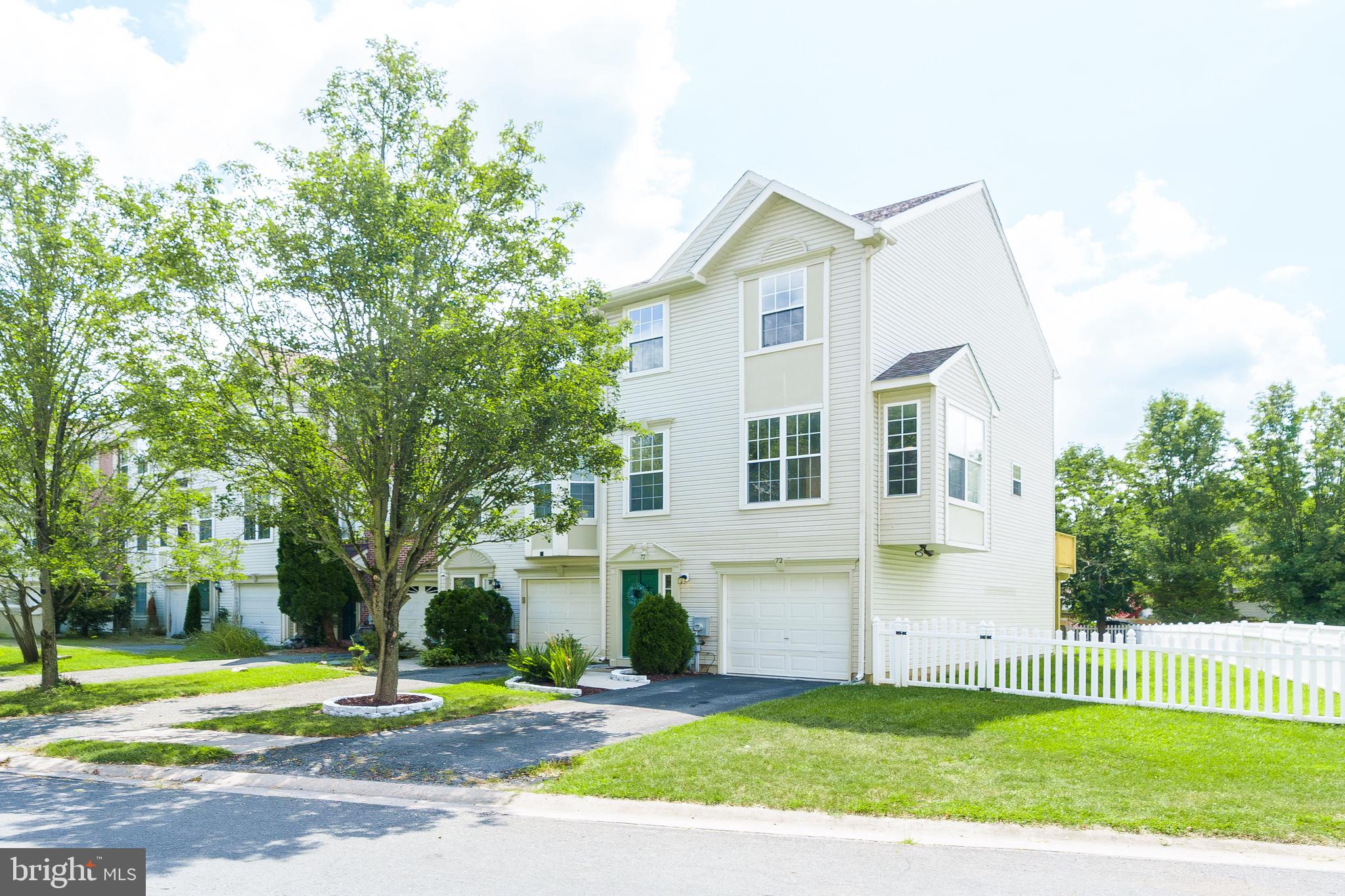 There's no place like home! Discover your dream home in this large end-unit townhome in Persimmon Creek that is packed with upgrades and move-in ready. The bright and inviting main level features a generously sized living room and kitchen. Off the kitchen is your newly upgraded deck perfect for enjoying relaxing views of your fully fenced backyard, ideal for pets, play, and privacy. Upstairs, you’ll find three comfortable bedrooms, including a luxurious primary suite with two walk-in closets and a private en-suite bathroom, your personal retreat after a long day. The lower level adds even more living space, with a convenient walk-out to the backyard. Bonus features include brand new front door with keyless entry, newly renovated attached garage with remote access, brand new ceiling fans throughout, one of the largest driveways and yards in the community, and overflow parking available nearby. Recent whole-home updates include new roof (2021), new hot water heater (2022), and new AC and A-Coil (2023). Location? You can’t beat it! Just minutes from Delaware, I-95, the University of Delaware, and Pennsylvania. Whether you're a first-time buyer, investor, or looking to upgrade, this home checks every box. Don’t wait, schedule your private showing today and make this gorgeous townhome yours.