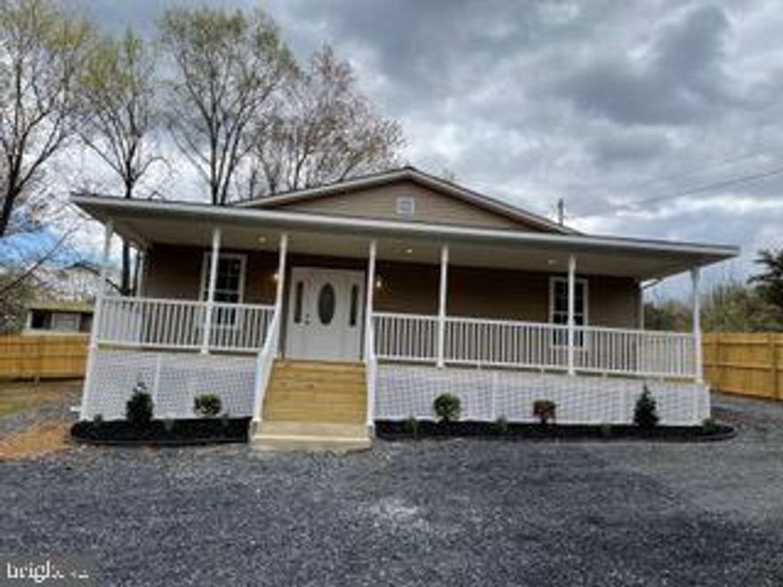 OFFER DEADLINE THURSDAY 5/6 AT 5PM. Cute-as-a-button newly constructed home. Original home was torn down and rebuilt from the foundation up.  New HVAC, new well and new septic (not conventional).  Home features gorgeous laminate floors throughout . Light and bright kitchen with tons of cabinets, side by side refrigerator and  double wall oven. Spacious bedrooms with large closets and two bathrooms. All of this surrounded by 1.32 wooded acres offering plenty of privacy. 7 niles from Cacapon State Park. 5 minutes from downtown. NO HOA.  Casa con TODO nuevo instalado, desde la fundación hasta el techo! Con 3 cuartos y 2 banos completos, esta casa esta lista para su familia. 1.3 acres para disfrutar la vida em familia con mucha privacidad. TODO ES NUEVO:  ventanas, electrodomésticos, lavadora, secadora, double hornos, fundación, techo, ventiladores, llaves, piso, porch! Todo esto sin pagar asociación! Esta casa esta ubicada cerca de Cacapon State Park. No te la pierdas - llama ahora para una visita!