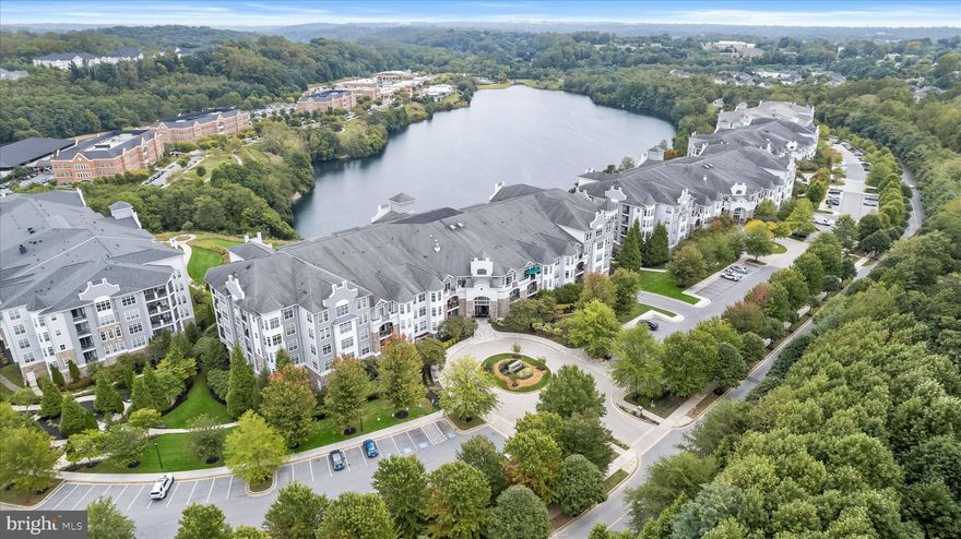 Introducing this spacious condominium in the highly coveted Cliffside in The Bluffs at Quarry Lake community, offering two bedroom suites with their own private bathrooms. Positioned on the first level of a secure building, this home makes an immediate impression with a welcoming foyer highlighted by intricate crown molding, and an open concept design that creates a warm and inviting atmosphere. Prepare your favorite meals in the kitchen that boasts granite countertops, a tile backsplash, 42-inch cabinets with undermounted lighting, a pantry, and stainless steel appliances including a double wall oven and electric cooktop. Entertain with ease in the dining room, where an elegant tray ceiling adds a touch of sophistication and sets the perfect backdrop for memorable gatherings. Relaxation comes naturally in the living room, while the den offers additional lounge space and sliding glass doors outside to the patio. Behind French doors, an office provides a versatile area ideal for a quiet work space. The primary bedroom suite features a tray ceiling, two walk-in closets, and a private sitting room that also has access to the patio. The ensuite bathroom includes a dual sink vanity, soaking tub, and a walk-in shower with a bench. Located on the opposite side of the home is the second bedroom suite, with its own walk-in closet and ensuite bathroom that has a walk-in shower. Completing the home is a convenient laundry room with storage space and a half bathroom. Life in this exceptional gated community offers peace of mind comforts, with fantastic amenities including the Lakeshore Club with a fitness center and entertainment spaces, an outdoor pool, tennis court and so much more. Quarry Lake shopping center is moments away, with an array of dining, shopping, and entertainment options to complement your lifestyle, with beautiful walking trails along the lake. One assigned garage parking space (28), along with a storage locker, provide practicality and convenience to complete this remarkable home.