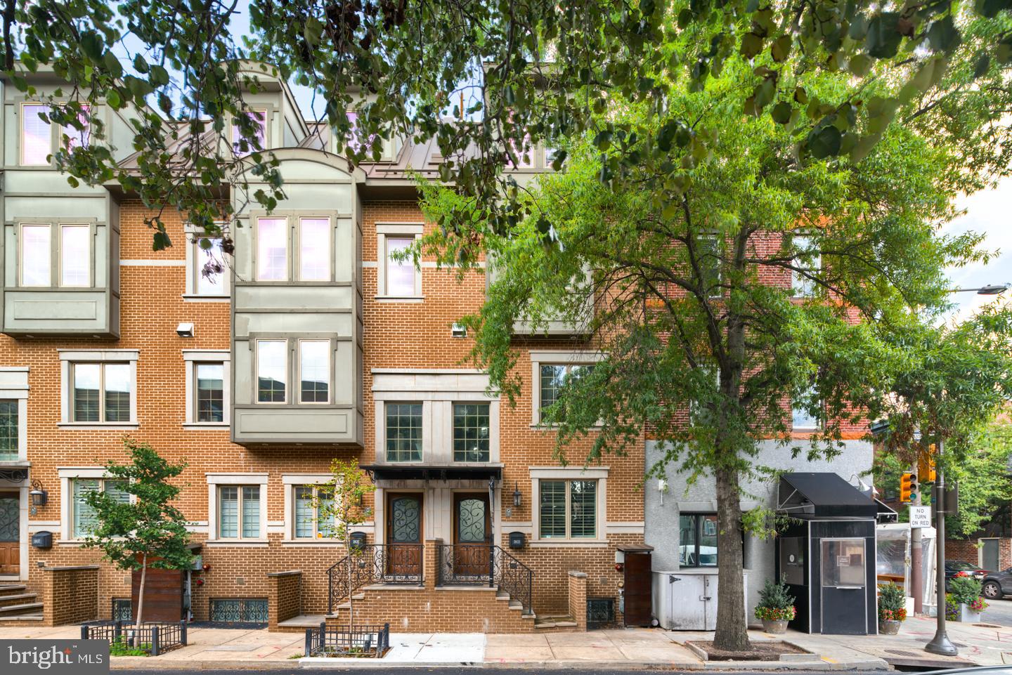 Steps away from Rittenhouse Square and nestled upon tree-lined Lombard Street sits this move-in ready three bedroom, three and a half bathroom residence. Complete with five light-filled levels featuring designer amenities, an oversized garage, and five years remaining on its property tax abatement, 1803 Lombard Street is one home you don’t want to miss.
After entering through the welcoming foyer, you’ll instantly fall in love with all that this townhome has to offer. Adorned with an elegant light fixture, the entryway leads to a powder room and the attached one-car garage.
Ascend the staircase to your modern main level boasting an open-concept floor plan, rich wood floors, and oversized windows. The living room has custom built-ins, a private balcony, and a gas fireplace surrounded in brick. Adjacent, the chef’s kitchen showcases sleek wood cabinetry, upgraded quartz countertops, a large center island, high-end stainless steel appliances, including a Wolf range and Viking refrigerator, and ceramic tile backsplash. Overlooking the kitchen, there is a formal dining area, ideal for entertaining with ease.
On the third level, two generously sized bedrooms with ample closet space share use of a designer-appointed hall bathroom with a dual vanity and tub shower. Nearby, there is a laundry room with a Whirlpool washer and dryer. Spanning across the top floor, a luxurious primary suite enjoys incredible custom-built closet space and a spa-like ensuite bath. This lavish bath has radiant heated flooring, floor-to-ceiling tilework, a soaking tub, a dual vanity, a glass enclosed stall shower, and a Toto toilet.
Pass by the wet bar and wine fridge to access the picturesque bi-level roof deck showcasing 360 degree city vistas. Offering an outdoor kitchen with a Solaire grill, lighting, and speaker system, this spot will truly serve as your personal city oasis. For added recreation space, the lower level leads to a full beverage bar, a climate-controlled wine room, a full bathroom, and storage.
Part of Lombard Estates and located in the desirable Greenfield Catchment, this residence has a premier address and a private gated courtyard entrance. A nationally renowned green urban space, Rittenhouse Square is known for its host of tongue-wagging real estate, luxe shopping, and avenues chockablock with restaurants and bars that boast local character. Stay tuned-- professional photos will be posted early next week!