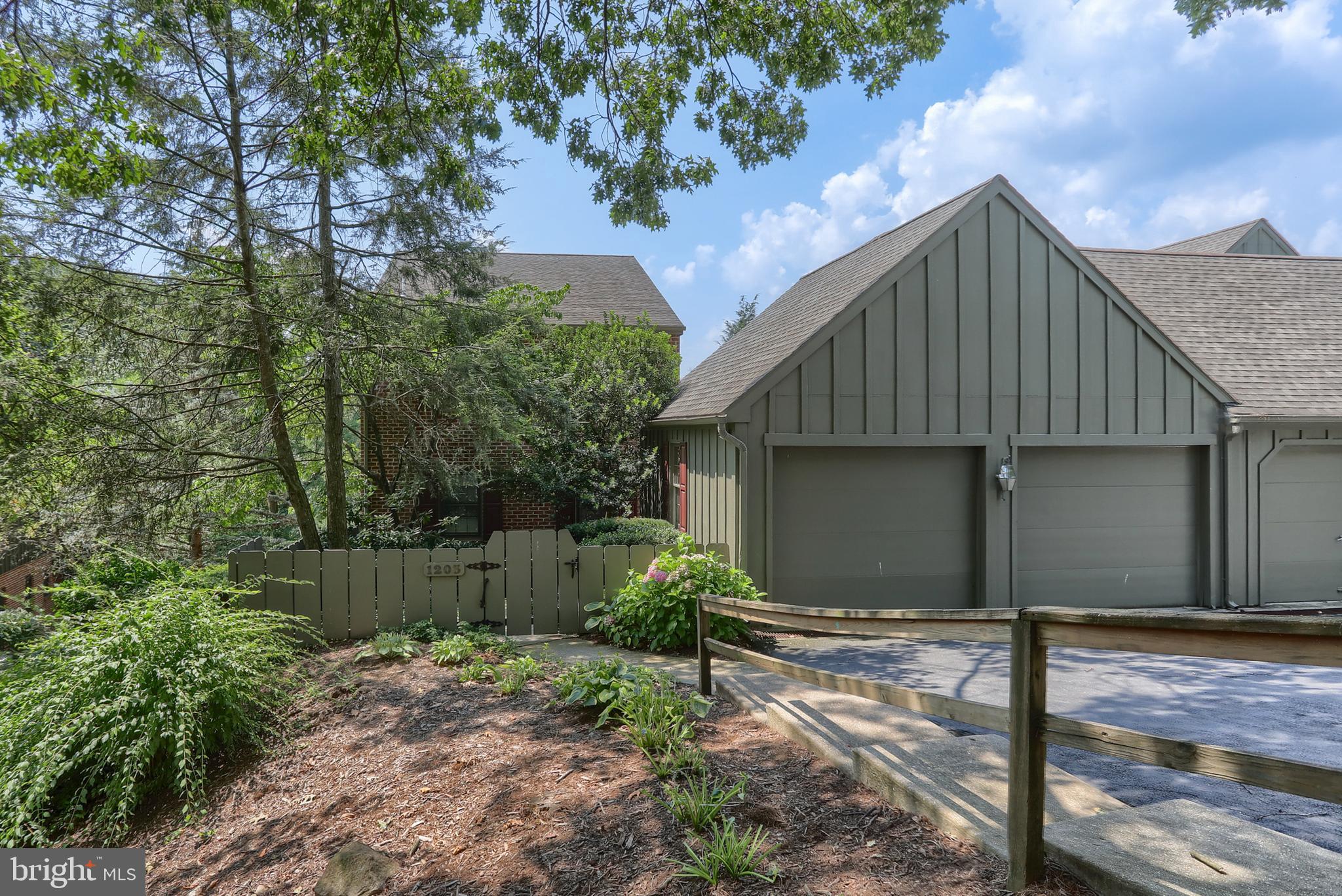 Welcome to popular Oakmont-the wooded oasis in the heart of Derry Township. As you enter the beautifully landscaped garden area you are then welcomed by an inviting private brick courtyard. This open, light and bright end unit has an awesome view of trees and offers complete privacy. The term treehouse comes to mind especially when enjoying the view from the eat in kitchen or screened in porch. This home offers true one floor living with a formal living room boasting a gas fireplace flanked with built-ins, a formal dining room with a large bay window and a remodeled, updated kitchen. Walls have been removed giving the 1st floor an open feeling while the hardwood flooring offers a classic flare. The large primary bedroom suite offers lots of natural light and ample closets, space for custom furniture along with an upgraded private bath. A powder room and laundry room complete the 1st floor. The 2nd floor features 2 oversized bedrooms that share a jack and jill bath. Don't miss the large walk-in hall closet for extra storage. The lower level is a walk out and features a family room with a 2nd gas fireplace, office area, full bath and storage. There is also a covered patio off the family room perfect for enjoy the outdoors. The attached 2 garage is wonderful not just for parking but extra storage as well. A few recent upgrades include the removing of walls, hardwood flooring, remodeled kitchen and the HVAC was replaced in 2025. This one is move in condition and offers so much space for every aspect of life.
