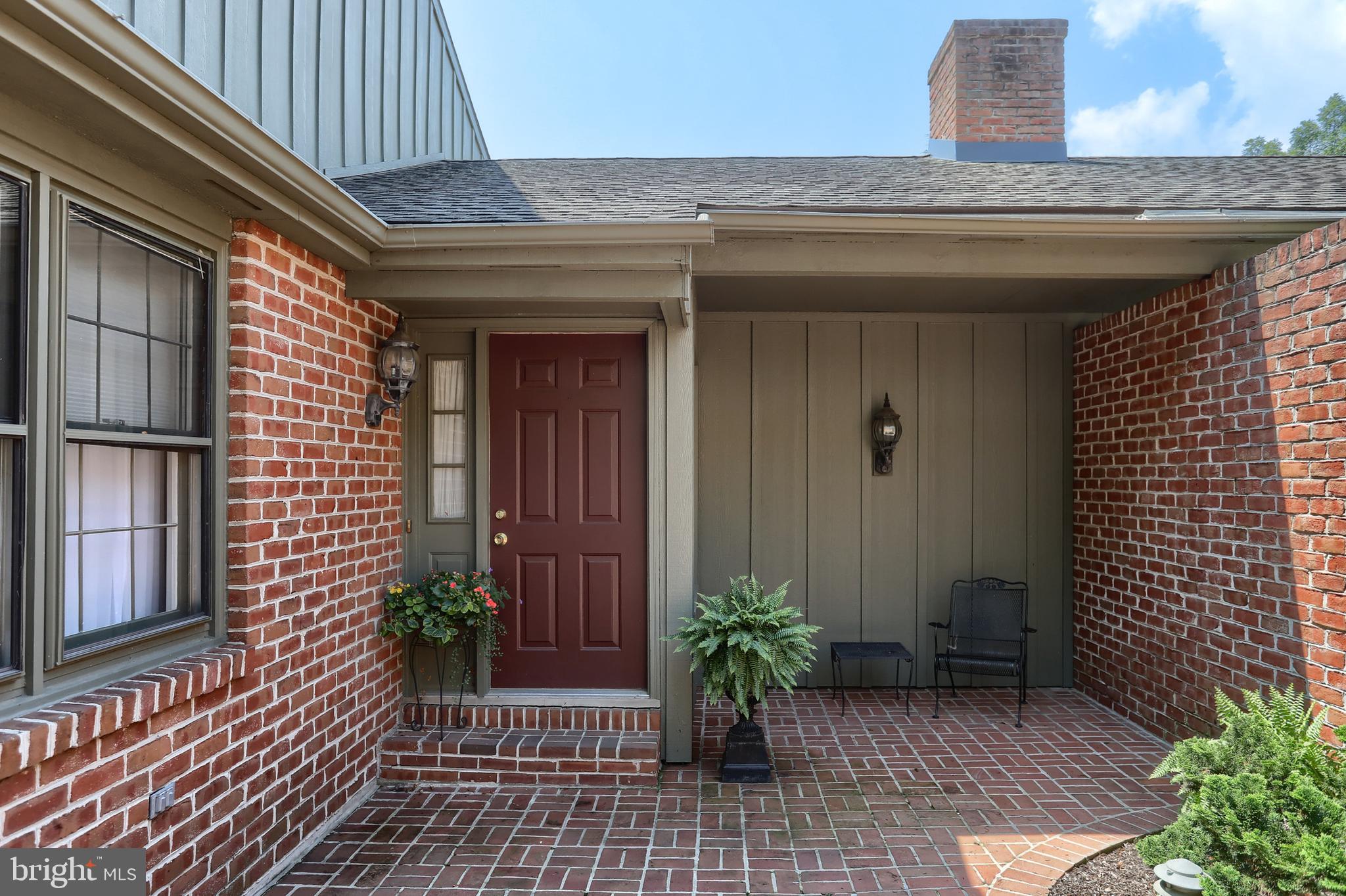 Welcome to popular Oakmont-the wooded oasis in the heart of Derry Township. As you enter the beautifully landscaped garden area you are then welcomed by an inviting private brick courtyard. This open, light and bright end unit has an awesome view of trees and offers complete privacy. The term treehouse comes to mind especially when enjoying the view from the eat in kitchen or screened in porch. This home offers true one floor living with a formal living room boasting a gas fireplace flanked with built-ins, a formal dining room with a large bay window and a remodeled, updated kitchen. Walls have been removed giving the 1st floor an open feeling while the hardwood flooring offers a classic flare. The large primary bedroom suite offers lots of natural light and ample closets, space for custom furniture along with an upgraded private bath. A powder room and laundry room complete the 1st floor. The 2nd floor features 2 oversized bedrooms that share a jack and jill bath. Don't miss the large walk-in hall closet for extra storage. The lower level is a walk out and features a family room with a 2nd gas fireplace, office area, full bath and storage. There is also a covered patio off the family room perfect for enjoy the outdoors. The attached 2 garage is wonderful not just for parking but extra storage as well. A few recent upgrades include the removing of walls, hardwood flooring, remodeled kitchen and the HVAC was replaced in 2025. This one is move in condition and offers so much space for every aspect of life.