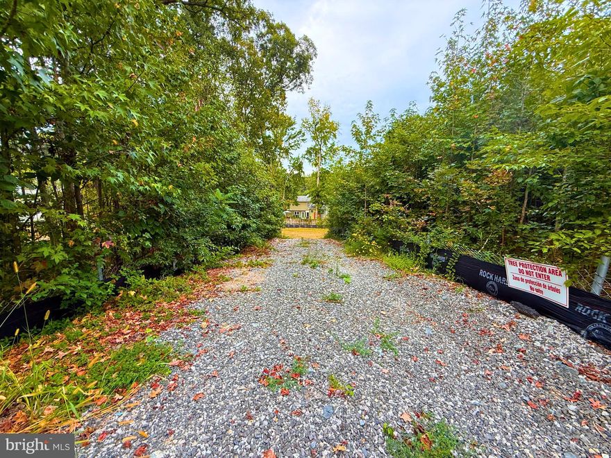 Build your dream home on this rare 0.51-acre lot in Lorton, ideally located near major roads, shopping, and amenities. Most of the land is cleared, and the majority of the wooded area behind the silt fence is also included, giving you a mix of open space and privacy. This property backs up to the highly sought-after Crosspointe Neighborhood and features public water and sewer (approved sewer easement from Crosspointe) with no HOA, providing flexibility to design the home you want. Perfect for buyers seeking a prime Fairfax County location with convenience and charm!