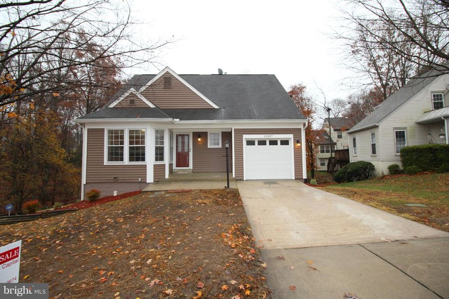 House Beautiful!! Wide open spaces outside lots of trees/Inside lots of room!!Neutral decor, freshly painted, upg. w/w sunny SUN room, VAULTED ceilings, ceil. fans, sunny eat in kitchen, 2 main level brs 4 full baths, lots of storage, deck, patio, privacy plus...one car garage