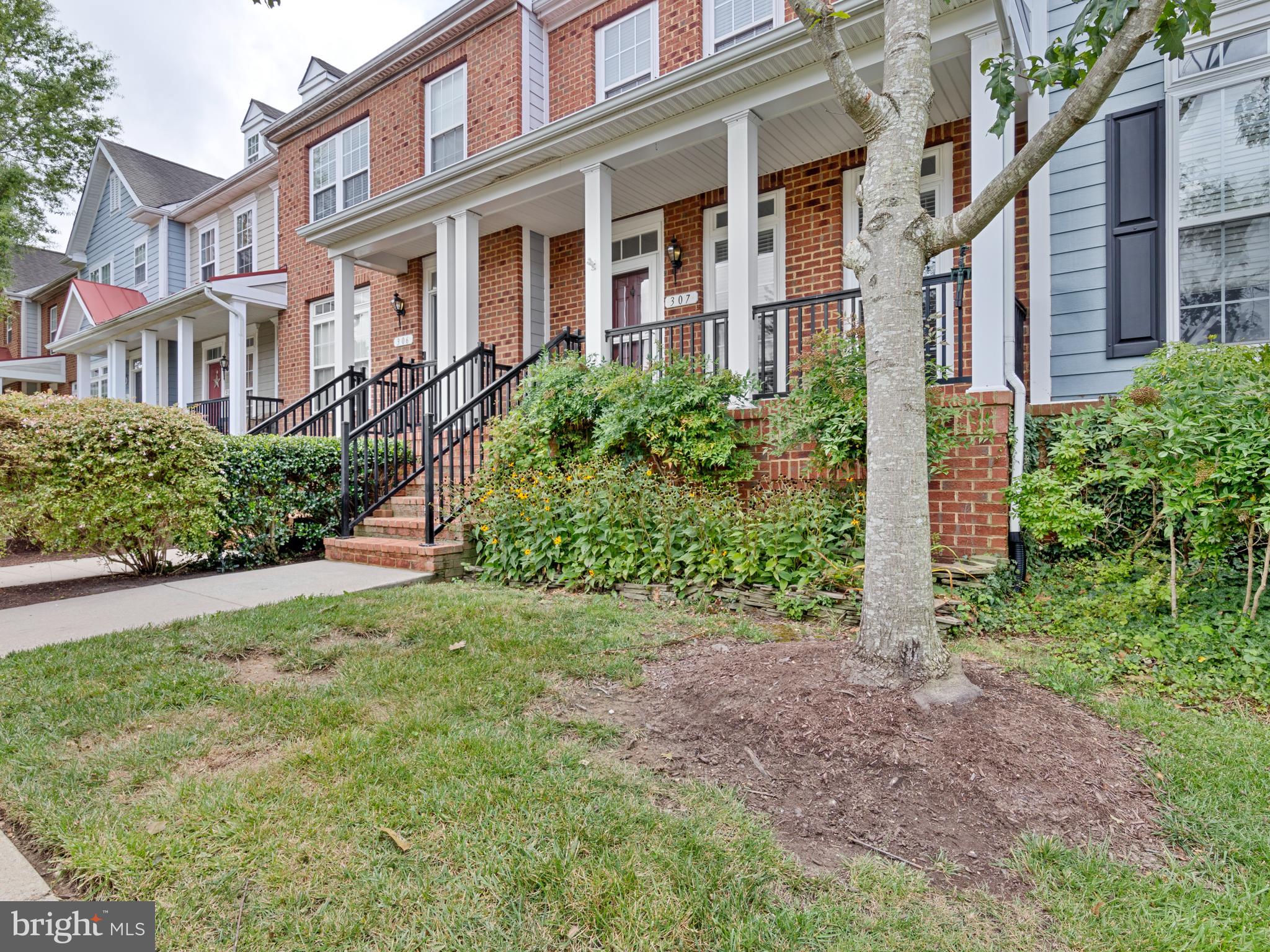 This beautifully updated townhouse offers an abundance of recent upgrades and a prime location just minutes from downtown. Step inside to freshly painted interiors, brand-new carpet, and hardwood floors that highlight the main level. The open layout features a bright kitchen with granite countertops, upgraded GE appliances, and a dining area that opens to a balcony-style deck. A spacious living room completes the level, offering the perfect setting for everyday living. Upstairs, the primary suite boasts a full bath, walk-in closet, and a versatile loft with a 2024 Mitsubishi mini-split AC/heat system. Two additional bedrooms and another full bath provide comfort and flexibility for family or guests. The lower level adds even more living space with a cozy family room, half bath, laundry area, and convenient access to the garage with built-in shelving. Major recent improvements include a new roof with CertainTeed Landmark architectural shingles (2025), new exterior paint (2025), a new hot water heater (2025), and a new main AC/heat system with outside compressor (2025, installation pending).
