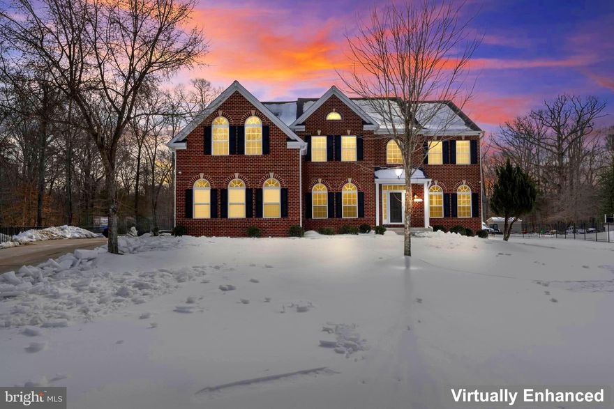 Welcome to a rare, one-of-a-kind luxury estate in the highly sought-after Timber Highlands, set on over 2 private acres and featuring more than $300,000 in custom upgrades, and no HOA. 
This exceptional property offers the perfect blend of privacy, technology, and resort-style living, just minutes from National Harbor, Washington, DC, and Northern Virginia. 
From the moment you arrive, the automatic gated entry with call box, extended driveway, and three-car garage create a grand first impression. A state-of-the-art smart security system with automated lighting and 12 strategically placed cameras—3 interior and 9 exterior—provides seamless control and enhanced peace of mind.
Inside, the home showcases a dramatic custom stone accent wall with architectural cutouts, soaring ceilings, elegant coffered ceilings in the family room, and modern BioBlaze bio-ethanol fireplaces that elevate the home’s sophisticated design.
 The open-concept layout flows seamlessly into the gourmet kitchen and entertainment spaces, including a sleek wet bar with glass cabinetry and mirrored backsplash, ideal for hosting and gathering. 
Designed for comfort and convenience, the home is equipped with a Generac whole-home generator with automatic outage detection and restoration, a full smart security system with automation and twelve cameras (three indoor and nine outdoor), outdoor landscape lighting, and an inground sprinkler system for both front and backyard.
 Huge finished basement includes a wet bar, private home theater features a 120-inch screen, projector, and surround sound for a true cinematic experience, while the glass-enclosed home gym with mirrored walls offers a stylish, motivating environment for daily workouts. The Pool table conveys!! 
The expansive primary suite serves as a private retreat with spa-like finishes and custom closets for clothing and shoes provide a touch of upscale luxury living. While secondary bedrooms are generously sized for family, guests, or home offices. 
The outdoor living experience is equally impressive, featuring a fully fenced yard, storage shed, custom outdoor sports court for basketball and soccer, and beautifully landscaped grounds across more than two acres, perfect for entertaining, recreation, and relaxation. 
Additional highlights include new roof,  two EV chargers in the 3 car garage (Tesla and GE), full irrigation, automated lighting, and abundant parking space for guests. This home offers a rare opportunity to own a gated, technology-driven luxury residence that combines comfort, security, and lifestyle in one extraordinary setting. Schedule your private tour today—homes of this caliber are truly a rare find.