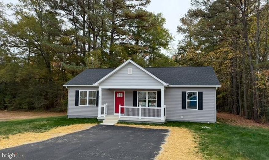 New Home now complete!  Home backs to seasonal Stream! Split Bedroom Plan w 3 bedrooms and 2 full baths on one level in a Water Access Community. 
Community Pool, Boat Ramp, So much more! Primary Home or Second Home at the River!
Home Includes Concrete foundation with concrete Front Porch. Upgrade Sun deck with steps to grade.  Kitchen Island w Granite Top, Granite Counters in kitchen, Upgrade Stainless Appliances, Window Blinds, Flooring upgrades include LVP throughout, No Carpeting!  Asphalt Driveway! Photos are of another home recently completed. New Assessment for taxes not yet completed by the County.