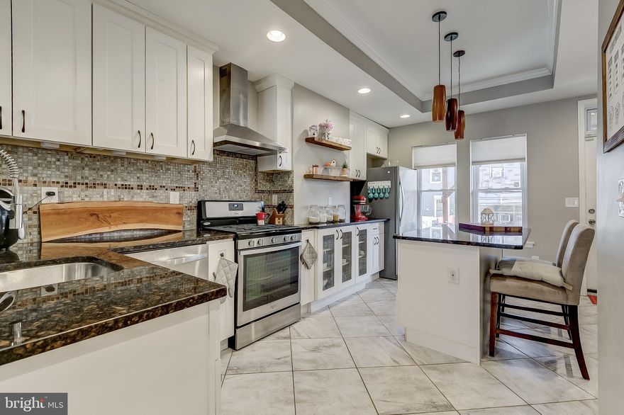 "CHECK ME OUT!" SAYS THIS AWESOMESAUCE PATTERSON PARK HOME.  3 BR & 3 FB, **5 YEAR (CHAP) HISTORIC PROPERTY TAX CREDIT ESTIMATED AT $17,500, FENCED-IN PARKING PAD Y'ALL! 3 UPDATED REAR DECKS INCLUDING A ROOFTOP DECK, S/S APPLIANCES & GRANITE COUNTERTOPS, CROWN MOLDING, RECESSED LIGHTING, (BUT WAIT, THERE'S MORE!) HARDWOOD & CERAMIC TILE FLOORING FINISHED LOWER LEVEL/FAMILY ROOM, AMPLE STORAGE, 1/2 BLOCK FROM HISTORIC PATTERSON PARK. CLOSE TO RESTAURANTS, SHOPS, NIGHTLIFE, JOHNS HOPKINS MEDICINE, MERRITT CLUBS, CANTON PROMINADE, LITTLE ITALY, HARBOR EAST, INNER HARBOR, FELLS POINT, I-95 & I-83.