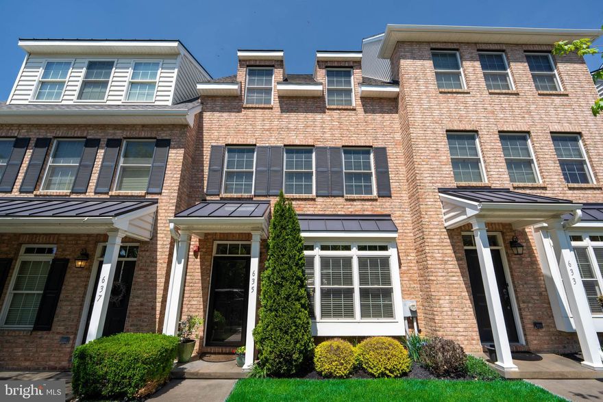 Welcome to 635 Magnolia, nestled in the highly sought-after community of Magnolia Place in the heart of beautiful Kennett Square, Pennsylvania. This is where sophisticated living meets everyday convenience, offering a lifestyle that is both refined and effortlessly walkable.

Kennett Square is known for its vibrant charm, award-winning restaurants, boutique shopping, local cafes, and year-round community events. Living here means you are never far from the action, yet this home provides the perfect balance of privacy and comfort within a meticulously maintained neighborhood that truly feels like home from the moment you arrive.

This townhome stands out not just for its location, but for the practicality it offers. A private two-car garage eliminates the need for street parking, while a fenced-in backyard with a beautifully finished patio creates the ideal setting for entertaining, relaxing, or even adding a hot tub for your own personal retreat.

Step inside through the front door or directly from the garage and you are welcomed by a wide-open main level designed for both everyday living and hosting. The living room is anchored by a gas fireplace and enhanced by built-in surround sound, creating the perfect atmosphere whether you are unwinding or entertaining guests. The space flows seamlessly into a formal dining area accented with carefully selected lighting and finishes, while hardwood floors add warmth throughout. A convenient half bath, generous coat closet space, and additional storage under the staircase complete the main level.

The kitchen is both functional and stylish, featuring newer stainless steel appliances, granite countertops, and a versatile breakfast bar that doubles as additional workspace. Every detail has been thoughtfully considered to make this home as practical as it is beautiful.

Just beyond, the private backyard offers a peaceful escape. Finished with cobblestone patio pavers and enclosed with vinyl fencing, the space provides privacy, quiet, and a perfect setting for outdoor gatherings, complete with outdoor speaker integration.

Upstairs, the second level offers two spacious bedroom suites. The primary bedroom features a walk-in closet and a beautifully upgraded en suite bath with modern finishes, tile work, and glass accents. A second bedroom,, includes its own walk-in closet currently used as a home office and full bathroom, along with high-speed connectivity including fiber optic capabilities. Additionally a conveniently located upper-level laundry area adds to the ease of everyday living.

Ascending further, the third floor opens up even more possibilities. Whether used as a third bedroom, media room, private office, or full-floor retreat, this level includes another full bathroom, closet space, a custom wet bar perfect for a coffee station or entertaining, and access to a rooftop deck with sweeping views of the surrounding area. This elevated outdoor space offers a unique extension of the home, ideal for relaxing evenings or hosting under the open sky.

With three full bathrooms, a half bath, surround sound throughout, and upgrades at every turn, this home was thoughtfully designed with no expense spared.

635 Magnolia is more than just a home. It is a lifestyle opportunity in one of Chester County’s most desirable locations, combining walkability, modern convenience, and refined living all in one.

Schedule your private showing today and experience everything this exceptional property has to offer.