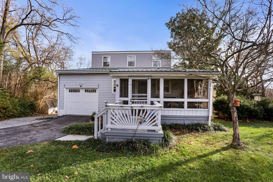 **RIVERFRONT PROPERTY**
Welcome to 434 Bedford Drive, a breathtaking waterfront colonial nestled on a rare one-acre lot along the Shenandoah River in Charles Town, WV. This beautiful property boasts panoramic views of the Blue Ridge Mountains and seasonal glimpses of the serene Shenandoah River, offering a peaceful and private setting that's perfect for a weekend getaway or full-time residence. Walk directly down to the river through the common area access at the bottom of the lot, where you’ll be surrounded by stunning mountain scenery and natural beauty.

Step inside to an inviting main level with an open floor plan that includes a bright, spacious living room, dining area, and two light-filled bedrooms. A rustic stone fireplace enhances the family room, creating a warm ambiance that's ideal for gatherings. Brand new deck. Throughout the home, ceiling fans provide comfort, while soft carpet adds a cozy feel to the primary suite, complete with a walk-in closet featuring built-in organizers. The screened porch and raised deck offer tranquil spaces to relax with your favorite beverage while taking in the vibrant hues of the sunset over the mountains.
The basement has been finished as a one bedroom self contained apartment with a private entrance. Everything is brand new with its own separate water heater and laundry, making it a perfect in law suite or rental property. Outside, the expansive backyard with mature trees and landscaped grounds provides an ideal oasis for outdoor dining, grilling, and soaking up the tranquil surroundings. 
Improvements include -
***New Roof - New Well - New Windows - Renovated bathrooms - New Flooring throughout***

Conveniently located near Rt. 9 and the local train station, this Jefferson County gem offers easy access to the Washington, DC Metro area, making it a perfect blend of rural charm and commuter convenience. With its remarkable setting, inviting interiors, and ample opportunities for customization, 434 Bedford Drive is a rare find in the heart of Charles Town. Don’t miss the chance to make this waterfront retreat your home—schedule a showing today!