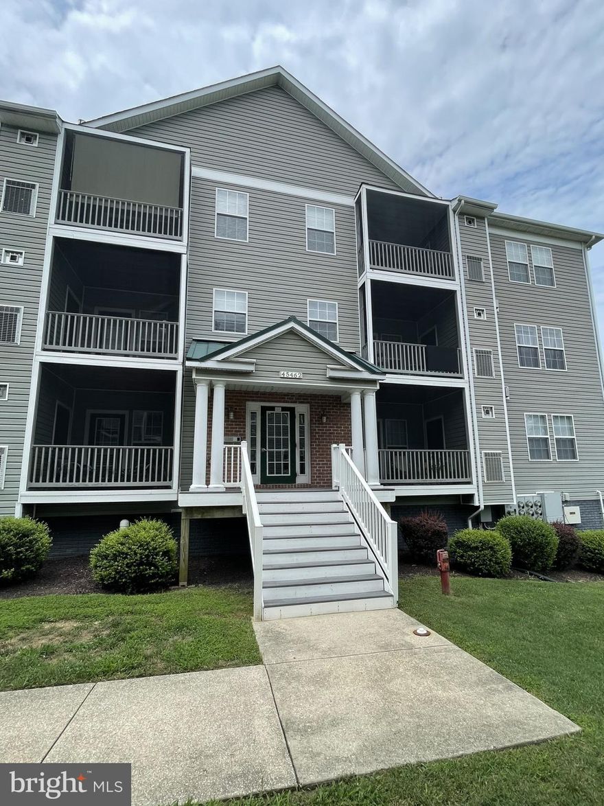 2 bedroom, 2 bath second floor condo featuring granite counter tops, living room fireplace, with a screened  deck/porch, storage unit in basement garage with one assigned parking space. Intercom access for guests, elevator, and main entrance sitting area. HOA features pool, workout area and club house. Perfect for that person on the go!!! Settlement must occur on or after January 1, 2026