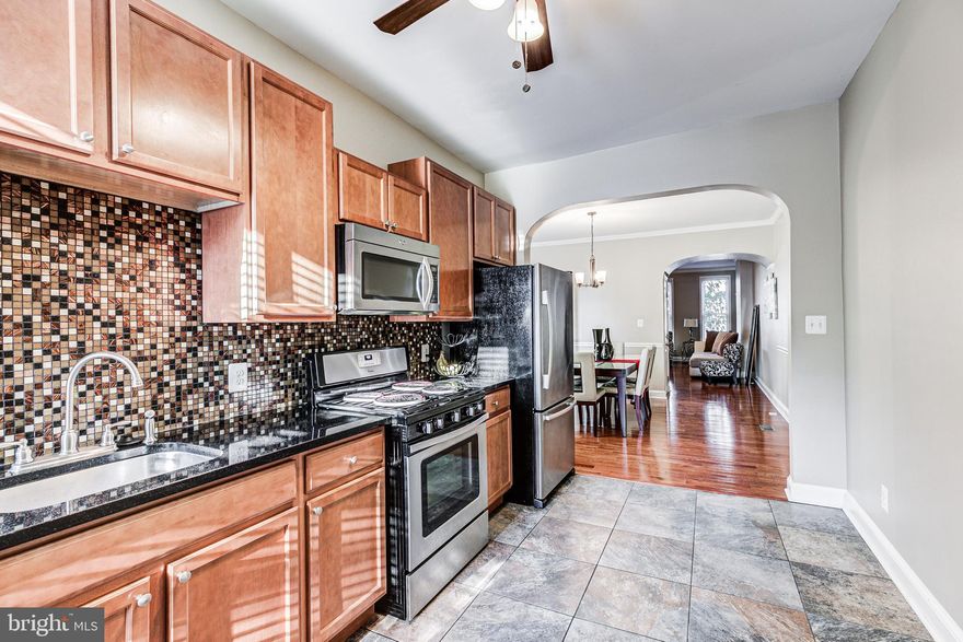 Major Price Reduction!! Make this home yours for the Holidays. Welcome to your urban oasis in the heart of Baltimore's thriving Oliver neighborhood! This charming and spacious 3bd/1.5ba rowhome is an absolute gem, boasting an updated interior that is sure to steal your heart. Step inside and be greeted by the warmth of hardwood flooring, tasteful crown molding, and an open, inviting layout that's perfect for both relaxation and entertaining. The kitchen, adorned with sleek granite countertops and gleaming stainless steel appliances, is a culinary enthusiast's dream come true. But that's not all – the magic continues downstairs in the finished basement, offering endless possibilities as a cozy den, home office, or recreation space. Upstairs you will find three large bedrooms, spacious closet space, a new front load washer and dryer for convenience,  and an updated bathroom. With a location just minutes from Penn Station, the vibrant Station North Arts District, and the heartbeat of downtown Baltimore, you'll enjoy the city's culture and convenience at your doorstep. Schedule a tour today so that you can pack your bags and move right on in!