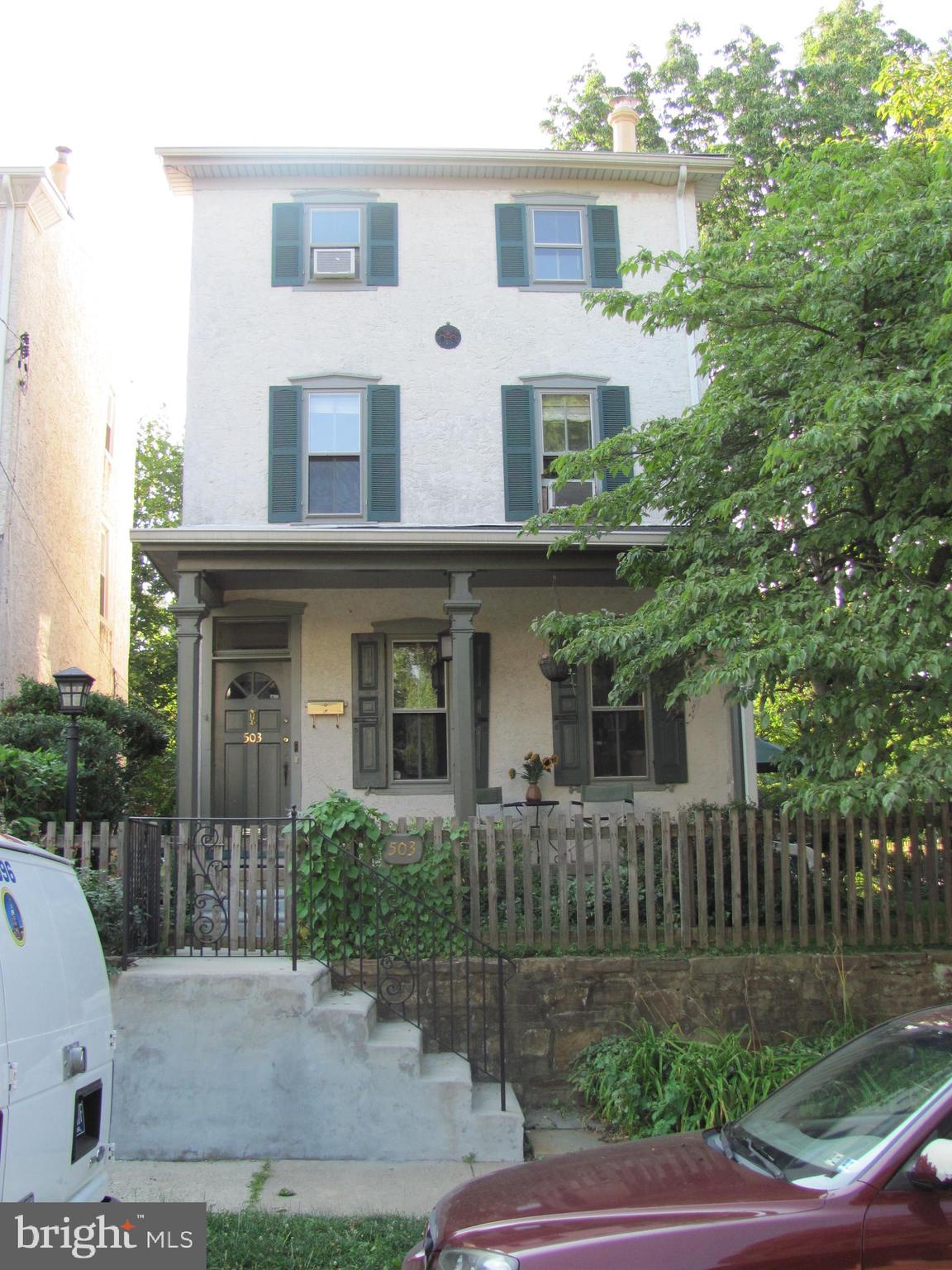 A RARE OPPORTUNITY for someone who wants to live in the heart of W. Mt. Airy with the option of earning a valuable rental income! Here is the ideal situation for living in one section and renting out the other. Conveniently located a few blocks from Carpenter Woods, one block from Mt. Airy Coffee, Tiffin, and walkable to the Mt. Airy Tap Room, Allens Lane Art Center, EVOO pizza, CVS and more. Easy access to public transportation, both train and bus.
Built around 1876-1885, this 3-story Victorian single was divided into two residences in the early 1940’s.
Surrounded by a fenced in yard, this home offers off-street parking and 440 sq. ft. of bonus space in a former garage converted to a studio. The light-filled studio includes heat, ceiling fan, cooling unit, a full bathroom with walk-in shower, a sink, mini-fridge, counter space, a built in workbench and a loft area that is easily accessible by a custom designed pull down ladder. This space is unique, terrific and ideal for the creative artist in you, the yogi or the extra guest!Â
Back to the main house, here is the floorpan:
The first floor living quarters are privately accessed through the arbored gate at the corner of W. Mt. Pleasant and Cherokee. Enter into a spacious den with radiator heating, a ceiling fan, a large coat closet and two privacy doors that lead to the main hallway.Â
To the left, the eat-in kitchen has beautifully maintained, random width, red pine floors. The kitchen is outfitted with gas cooking, a double sink, a dishwasher, garbage disposal, and refrigerator. The island adds extra prep space, cabinetry and has a classic pot rack hanging above, among the pair of down lights. The pine floors continue past a set of french doors that lead into the living room. Bookshelves on either side of the doors offer great space and harness such character. The decorative fireplace has a colorful tile surround. There is a spacious walk-in closet off of the hallway that was most recently used as a dressing room and access to the basement which houses two hot water heaters (one for each living space (2018)), two electric panels, two Weil McLain boilers, a cedar closet, workbench, lots of storage space and access to the back yard via bilco doors. The first-floor primary bedroom is at the back of the house, with windows overlooking the garden. Exit through the back door for easy access to the private yard that is a gardener’s delight, the private driveway, the studio and plenty of patio space to cultivate your own respite. The first-floor bathroom shows off quintessential Mt. Airy tile with shower over tub, a privacy window, a sink and lots of vanity space.
Through an interior door off of the living room or by way of the front door at 503 W. Mt. Pleasant, you’ll head upstairs to the second and third floor living space with lovely hardwood floors. The second floor has a large eat-in kitchen, beautifully bright with lots of natural light and slate tile flooring. A door off of the dining area leads to an outdoor deck. Next to the kitchen is a living room with ceiling fan. At the front of the house is a large bedroom with decorative built-in cabinets. At the entry end of the hallway is a large bathroom with shower stall, linen closet and tub. The third floor offers two more bedrooms with ceiling fans, closets, laundry, and a half bath. There is access here to the unfinished attic.Â
Easy access to public transportation, both train and bus.
Showings begin February 20, 2025