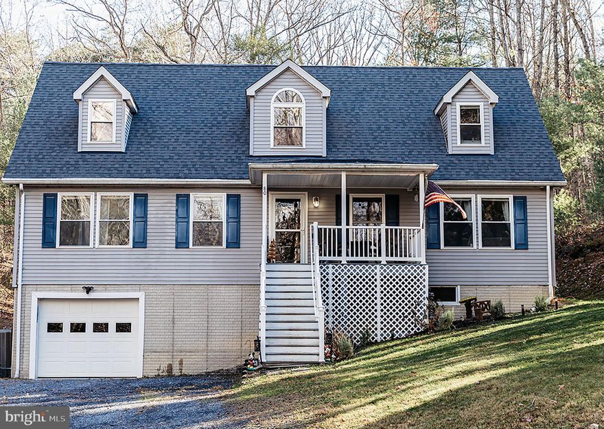 Discover this 4-bedroom, 2.5-bath home—complete with an extra lot—in the wooded section of Bryce Mountain. This well-maintained property offers a spacious layout and excellent functionality, featuring an expansive rear deck perfect for outdoor dining and gatherings. Additional highlights include a 1-car garage and a large unfinished basement ideal for storage or future expansion.

The main level features the primary bedroom, laundry area, kitchen with pantry, open-concept living space, and an additional den. Upstairs, you’ll find three bedrooms and a full bath. The sale also includes a second parcel located across the road, preserving the natural setting and enhancing the combined total of approximately 0.69 acres.

Enjoy a private, wooded backdrop and convenient access to Bryce Resort—a four-season destination offering golf, skiing, dining, a small airport, a lake with recreational opportunities, and numerous hiking and biking trails. This property provides a versatile setting that combines comfort, space, and proximity to year-round amenities.