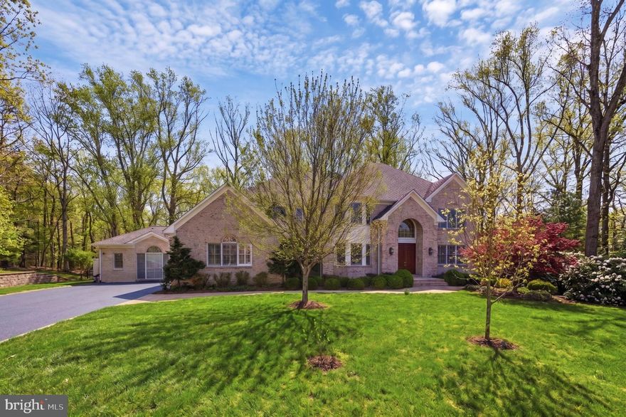This spectacular all brick colonial, built in 1996 and beautifully renovated, sits on a private 1.6 acre wooded lot with a walk out lower level in the Langley school pyramid, just minutes to Tysons, Vienna, Reston Town Center, and Great Falls.

A standout feature is the amazing connected yet private two level in law suite offering over 3,000 square feet. This exceptional space includes a primary bedroom, two and a half baths, a cathedral ceiling secondary great room, a spacious private kitchen, a dedicated work station hub, and a private entrance. Its own lower level features a finished rec room and a second bedroom, allowing extended family and guests to enjoy complete independence.

The main home offers a dramatic two story foyer, two story family room with gas fireplace, and a formal living room with wood burning fireplace. The renovated chef’s kitchen features Thermador refrigerator and freezer, warming drawer, steam oven, pot filler, and a large island, opening to a dining area and a light filled sunroom with a glass solarium ceiling. A functional service room with island serves as a family foyer with cubbies, work stations, laundry, and pet area. Two half baths complete the main level.

Upstairs, the primary suite includes a sitting room, fireplace, heated bathroom floors, and a walk in closet. Two bedrooms share a Jack and Jill bath and a third has an ensuite. An additional washer and dryer add convenience.

The walk out lower level includes a rec room, media room, bedroom, full bath, wet bar, and storage, plus a bonus flex room ideal for a gym, office, or playroom.

Outdoor features include a sundeck with covered seating, professional landscaping with irrigation, playground area, path to Wolf Trap trails, and a dual zone invisible fence. Additional highlights include a three car garage with specialty bay, whole home Sonos audio, Lutron lighting, motorized shades, reverse osmosis water system, and a three zone HVAC system with a separate solarium system.

Nearly $1.2 million in upgrades complete this exceptional offering.