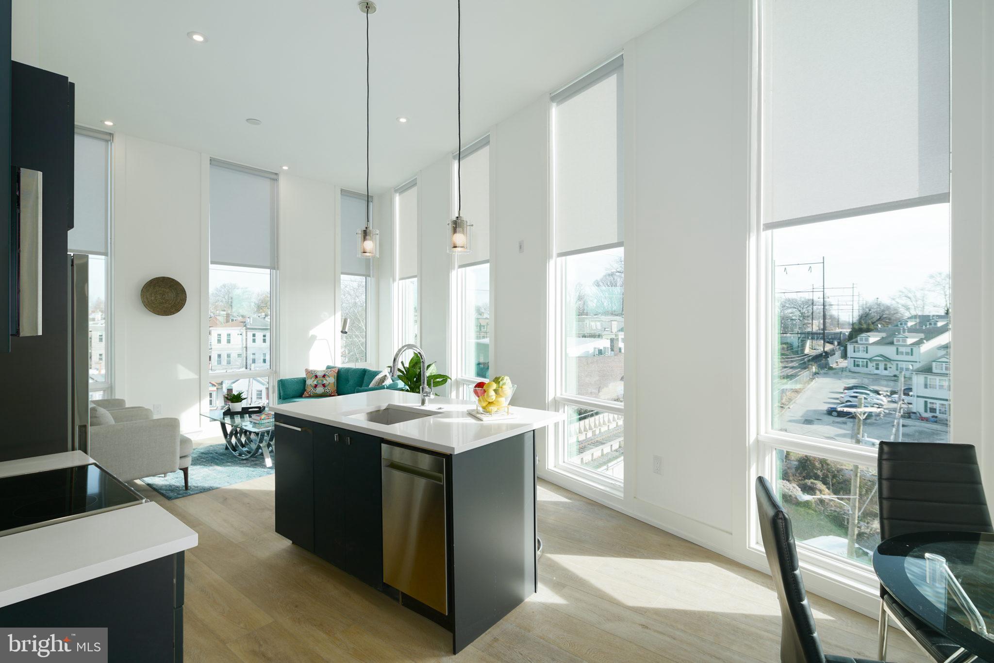 The Meadowline, a one-of-a-kind, new construction luxury apartment building, is currently accepting tenants! Situated in Philadelphia's Kingsessing neighborhood, The Meadowline has everything one could need inside and out. With 65-units over five floors, there are 1 BD/1 Bath, 2 BD/1 Bath, and 2 BD/2 Bath units available, with plenty of floor plans to choose from. The building features (2) elevators, a state-of-the-art fitness center with Peloton bikes, Latch keyless entry, bike storage, dedicated mailroom, and an artfully designed communal lounge with observation deck. Each unit has been tastefully designed throughout. Kitchens feature stainless steel GE Haier appliances, matte black cabinetry, Mitzi pendants, and pure white quartz countertops. CB2 kitchen hardware is accented by the Delta fixtures and the pure white quartz countertops are accented with beautiful Ann Sacks backsplash. Bathrooms feature Ann Sacks tile, floating vanities, mirrors with built-in lighting and Delta fixtures. Each bedroom is adorned with an artistic light fixture. The Meadowline also features an extensive Apiary designed outdoor experience with dog park, picnic areas, community garden plots, elevated landscaping and more! To enhance the overall design of the building, unique finishes have been selected such as Corten metal, and Vermont slate. With 24 hour surveillance, dedicated secure parking spaces, and a walk score of 84, do not miss your chance to move in! 1 BD units start at $1300/mo. 2 BD units start at $1650/mo. $50 application fee/applicant. Parking available on a first-come, first-serve basis. $45 flat water fee/mo. Photos of similar unit