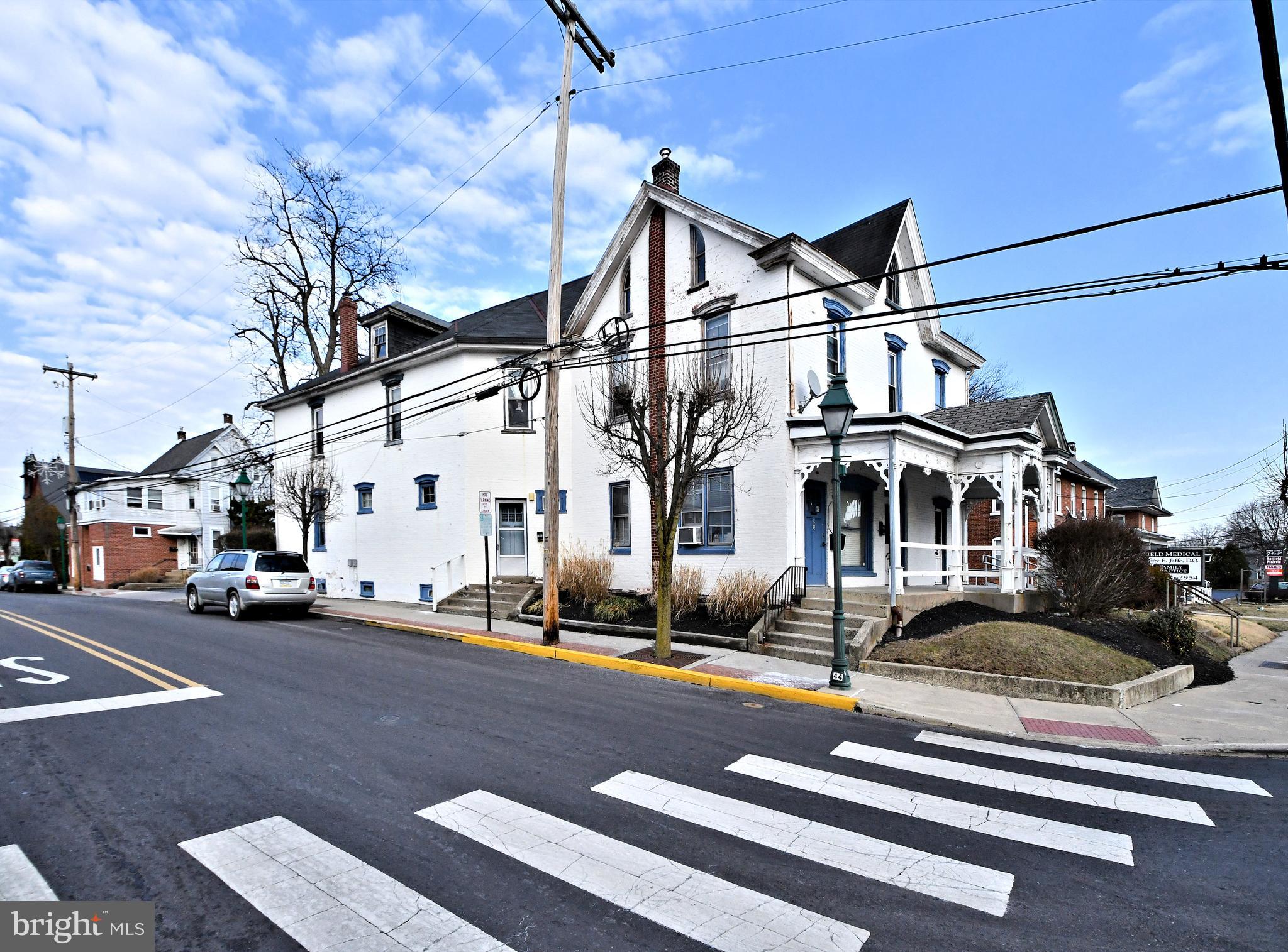 Recent Price Adjustment!
Welcome to 105 S Main Street Hatfield. Nestled in Hatfield Borough this Commercial mixed-use property has much to offer. Highly visible from its corner location, there are many possibilities and uses making it ideal for various businesses. Additionally, it provides an excellent development opportunity as well with it being centrally located in the borough.
Do not visit the property without a scheduled showing as the medical practice is actively seeing patients.
Currently the first level is a long-standing medical practice. With a reception area and 5-6 exam rooms along with extra file rooms and storage on first floor. This space can certainly be converted and updated for the next occupant.
The second and third levels are tenant occupied and can continue to provide a source of income.
Apartment 1 is a one bedroom and bath along with a 3rd floor loft (3 rooms) type area. It has its own entrance with a small foyer. The second is a 2-bedroom, one bath apartment with entry from the parking area that takes you to the second floor. There are additional rooms in each apartment area as well.
The rear entry for the apartment to third floor has a storage room alongside. This room has electric and plumbing and can provide additional options.
Also, the property has a full unfinished basement providing storage. 8 off street parking spaces along with a handicap space provide a valuable feature for 105 S. Main in the Borough.
As Hatfield Borough continues to grow, 105 S Main is ideally located to grow in value with it.
The location is conveniently located to major thoroughfares such as I476, Rt. 202, Rt. 309. This property provides one with an excellent opportunity to invest in a strategically located area.
Owner would consider remaining in a lease back scenario as his medical practice is located on the first floor.