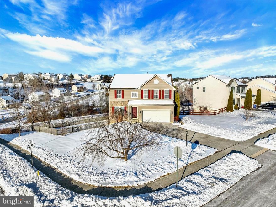 Luxury, space, and flexibility come together in this beautifully upgraded South Hanover home — offering far more than meets the eye. Thoughtfully designed and impeccably maintained, this residence delivers two fully equipped living spaces, ideal for multi-generational living, extended guests, or today’s evolving work-from-home lifestyle.
Just off the entry, a beautifully proportioned front living area offers the perfect space for a sitting room, home office, music room, or formal entertaining, giving this home multiple living spaces to suit every stage of life. The main level continues with rich real cherry hardwood floors, abundant natural light, and an open-concept layout centered around a stunning stone-faced gas fireplace with slate accents and custom lighting. The chef’s kitchen features cherry cabinetry, granite countertops, recessed lighting, a large island, pantry, and breakfast bar, flowing seamlessly into the sunroom and family room — where the stone fireplace adds warmth and ambiance for everyday living and special occasions alike.
Step outside to the show-stopping 20’ x 19’ Trex composite deck with full lighting and a reverse staircase, overlooking a beautifully maintained open green space and dry retention area that creates exceptional privacy while inviting nature right to your backyard. Here you’ll enjoy deer, birds, and wildlife, peaceful sunsets, and the simple pleasure of sipping your morning coffee as birds chirp in the distance — a serene retreat rarely found in today’s neighborhoods. Whether hosting holiday gatherings or summer evenings on the deck, this home was designed for effortless entertaining and unforgettable moments.
Upstairs, the expansive primary suite offers a spa-like bath with soaking tub, tiled shower, granite double vanity, adjustable lighting, and a deep walk-in closet with dual shelving. Three additional bedrooms, a full bath, and a convenient second-floor laundry complete the upper level.
Wait until you see the exquisite finished walk-out lower level. Bright and beautifully designed, it features a full kitchen with granite counters, brand-new appliances and a full tiled bath, creating a true private living suite. A spacious multi-use main room — perfect for movie nights, game days, entertaining, or relaxing — is complemented by a French-door bonus room with tray ceilings and double-lighted closets, ideal for a bedroom, office, homeschool room, or studio. With its stone and slate accents, built-in 7-speaker Polk audio system, and private access, this level is ideal for in-laws, college students, adult children, guests, or hosting extended family over the holidays — delivering exceptional versatility rarely found in today’s market.
Additional upgrades include new plush carpeting with 8” padding, recessed and adjustable lighting throughout, Hunter ultra-quiet ceiling fans, upgraded glass basement doors, recessed mantle lighting, exterior metal light fixtures, a fully drywalled garage with opener, and in-ceiling audio in the main living areas — just part of an extensive list of high-end upgrades and custom enhancements — many of which would be extremely costly to replicate today — that elevate this home well beyond the ordinary.
Surrounded by beautiful countryside and just minutes from Codorus State Park — offering hiking, boating, swimming, camping, and endless outdoor recreation — this home enjoys a rare blend of natural beauty with easy access to shopping, dining, and commuter route to Maryland.
Set on a desirable corner lot close to the Maryland line, this is a rare opportunity to own a home that offers luxury finishes, flexible living, privacy, and exceptional care — a residence that truly lives larger, better, and more beautifully than most.