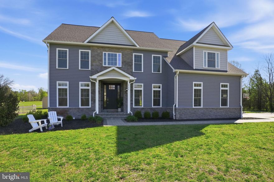 Welcome to your 11-acre dream oasis in Davidsonville!!  One of the most spectacular lots in Davidsonville featuring a horse paddock with run-in shed, custom-built chicken coop, fenced garden area, extensive nature/ATV trails, AND your very own baseball field!!  Add to that a stunning custom-built home with extensive upgrades and meticulous attention to detail, and you will quickly realize how truly special this home is!! The main floor features a RARE main-level bedroom with a FULL bathroom, a separate office, and a fully open gourmet kitchen and family room, ideal for entertaining. The 2-story family room with a stacked-stone fireplace serves as the anchor of the beautiful backdrop of this amazing property. Not to mention the oversized patio outside with a fireplace, pizza oven, and outdoor kitchen area. The upstairs is perfectly designed, featuring an expansive primary bedroom, en-suite second bedroom, and a jack and jill bathroom adjoining the third and fourth bedrooms - all with walk-in closets!! The basement is unfinished but fully utilized and completely enjoyed by the current owners.  Plumbed for a future bathroom, and the only limitation for this amazing 1400 sq ft of space is your imagination. Don't hesitate, as a home like this, a property like this, in sought-after Davidsonville, does not come around very often!!