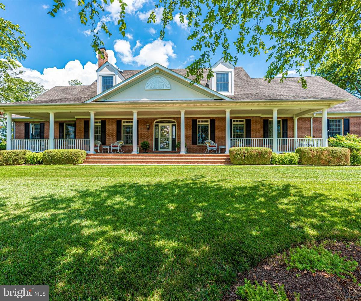 Explore the drone footage, 3D Matterport tour and virtual tour of this stunning 61+/- Acre sod farm with breathtaking vistas in every direction. This magnificent property incorporates a spectacular 7,555 SF custom built Contemporary Brick Cape Cod home featuring 4 bedrooms, 3.5 baths, 3 porches, a patio, 4 fireplaces, a fully finished basement, and a 2-car garage. This property also includes a 1,904 SF tenant house, constructed in 2005 this home features 3 bedrooms, 2 full baths, fireplace, and charming front porch. There is a 113' x 35' Metal 5 Bay Pole Equipment Shed with covered porch, and a 36' X 54' Metal Pole Barn that encompasses two horse stalls, a 30' x 36' office which is insulated and has electric, heat, and water. Call today to schedule your private showing.