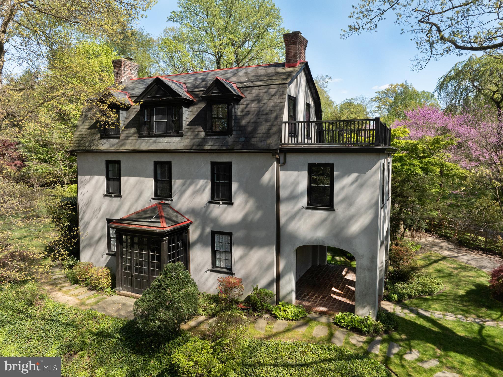 John Quincy Adams was President when the original part of this stately farmhouse was built in 1829. Additions were made in 1906, 1927, and 1960, resulting in the spacious property that exists today. This home is flooded with sunlight and has beautiful natural oak woodwork and hard wood floors throughout. The first floor offers a living room, a den, a large dining room with a wood burning fireplace, a kitchen with natural gas cooking and a butlers pantry and laundry area, a half bath, an enclosed side porch, and numerous Dutch doors. The second floor has four large bedrooms, one with an attached office that could also be used as a nursery, along with a full bath. The third floor has three more bedrooms, a storage room, and another full bath. There is a slate roof, and a newer boiler and water heater. The grounds are breathtaking. Out back there is a slate patio below a stunning pool that is perfect for cooling off in the summer and entertaining. The yard, one of the largest in the area, is expansive on both the side and to the rear of the property and has many beautiful natural plantings. The location can't be beat. The shops and restaurants at the Top of the Hill are within walking distance and a couple of blocks in the other direction the road takes you to one of the most tranquil spots in the Wissahickon Valley, where the Tedyuscung statue sits atop Council Rock. Septa regional rail is within couple of blocks for an easy ride to Center City and the Turnpike and Blue Route are a short drive away. Make an appointment to see this special property today. *Lot dimensions, assessments and taxes are both parcels combined