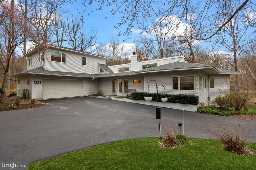 Modern Elegance Meets Natural Beauty at 1223 Old Ford Road
Welcome to 1223 Old Ford Road, an elegant contemporary masterpiece nestled on 1.5 acres in sought-after Huntingdon Valley. This meticulously maintained and thoughtfully upgraded 4,544 sq ft gem, offers a seamless blend of modern luxury and timeless style. As you enter, you are greeted by a grand foyer that flows effortlessly into an open-concept living space adorned with floor-to-ceiling windows allowing natural light to pour in and illuminate the home's exquisite features. The wood-burning fireplace anchors the living room and red oak floors add warmth throughout the main level.
The gourmet kitchen is a culinary delight, designed for functionality and elegance with high-end finishes, double islands for entertaining, and direct access to a spacious deck that overlooks a meandering tributary of the Pennypack Creek. A second deck on the main level features a 6-person spa where you can immerse yourself surrounded by nature.
With four generously-sized bedrooms and three and a half luxurious bathrooms, comfort and convenience are ensured for family and guests alike. Additionally, the home features a versatile office space that is thoughtfully designed to meet the demands of modern living and working. The room includes a convenient queen-size Murphy-bed, featured in the Philadelphia Inquirer, ensuring that your office can effortlessly transform into a guest suite whenever needed. 
In addition to the generous bedroom with ensuite bath that is perfect for guests or multigenerational living, the fully finished basement is an ideal space for recreation or relaxation. 
Thoughtful touches like a cozy reading nook off the kitchen, custom built-ins, and well-appointed closets - including two that are cedar-lined - enhance both comfort and function throughout the home. Smart home upgrades include app-controlled Nest thermostats (4), Lutron smart lighting, Level smart locks, garage door, and security system. A new Owens Corning Estate roof (2019) and a 4-zone Trane heat pump system (2022) offer energy-efficient peace of mind for years to come.
The home neighbors Lorimer Park and its expansive trail system, but is also just a short drive to staple amenities like Giant, Starbucks, Rite-Aid, and Iron Hill Brewery as well as two different SEPTA lines (West Trenton, Fox Chase).
1223 Old Ford Road offers a rare blend of luxury, nature, and convenience—your private sanctuary awaits.