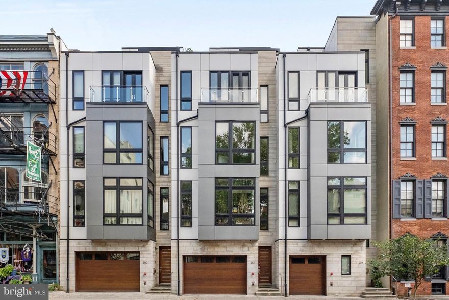 Rare opportunity to purchase a PRISTINE OLD CITY, 3700 plus Sq foot home, with a TWO CAR GARAGE,  ELEVATOR,  TAX ABATEMENT & hardwood floors throughout, in the heart of OLD CITY.
As you pull into your two car garage, and enter this magnificent custom home, you will see a an inviting outside space, office area, ELEVATOR,  and a regal open stair case, that takes you, up to THE MOST dramatic and WELCOMING dining and living area, with 15FT ceilings.  The kitchen boasts, top of the line cabinetry & appliances.  All white sandstone countertops, breakfast bar, and a perfectly situated dining area, framed by a Juliette balcony. The living room with amazing volume and windows, IMPOSING fireplace and marble mantle is the entertaining hub and heart of this home!
On the next level of this newly constructed residence, you will find two gracious bedrooms and stunning baths. As you ascend to the primary suite, the proportions of this bedroom and spa type bath are just SPECTACULAR! As are the two walk in closets. The DECK, with views of the Ben Franklin Bridge and ALL of Center City, is truly an extension of your living space SIX MONTHS of the year.
The finished lower level, with its own private outside space, full bath and wine cellar, just adds to all of the thoughtful elements of this magnificent must see home. Located just minutes from Jefferson and Pennsylvania Hospitals, as well as some of the city’s BEST dining and cultural attractions, this property has it ALL!