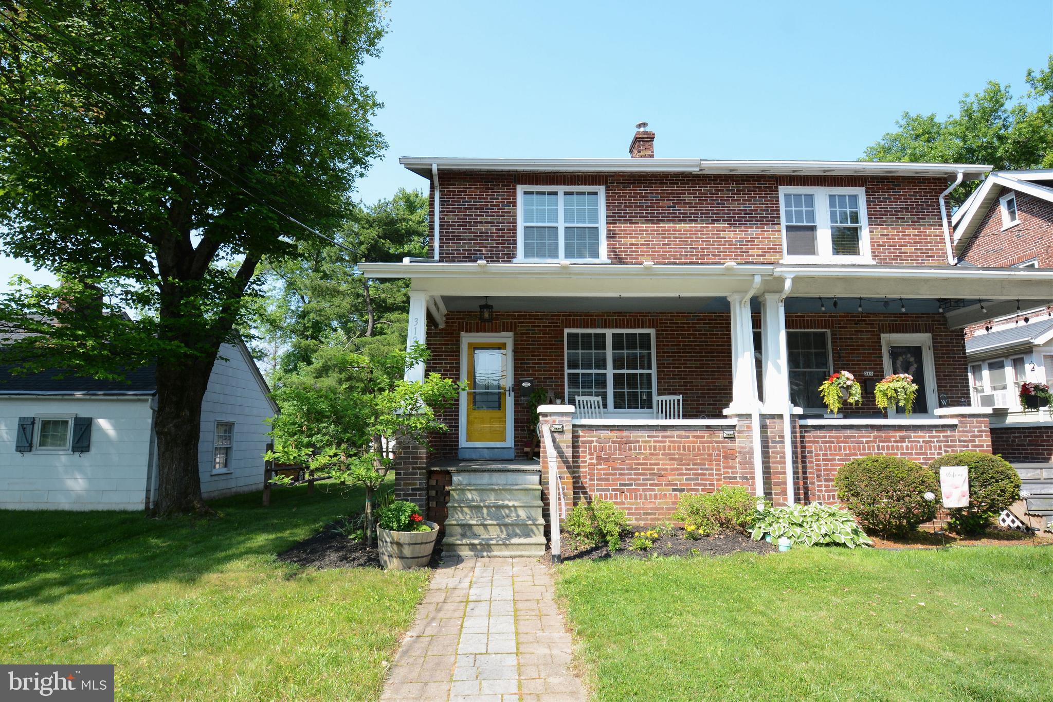 Welcome to this classic brick twin in the heart of highly desirable Souderton Borough. Traditional charm blends seamlessly with modern updates, making this home truly move-in ready. Enjoy multiple outdoor spaces—sip your morning coffee on the wide front porch, relax in the shade of the covered back deck, or host friends on the beautifully hardscaped patio. Inside, original hardwood floors and rich wood details offer warmth and character, while newer windows bring in plenty of natural light. The kitchen was fully renovated in 2022 and features floor-to-ceiling cabinetry, quartz countertops, a stylish tile backsplash, and stainless steel appliances. Upstairs you'll find three bedrooms and a full bath with updated fixtures. Need more space? The finished attic offers flexible use as an office, guest room, or extra storage. The partially finished basement provides even more living area or storage solutions. A detached garage with alley access adds convenience for parking, hobbies, or storing your outdoor gear. Located just steps from Lawn Avenue Park and a short walk to the Broad Theater, shops, restaurants, and breweries—this location can't be beat! Don’t wait—schedule your showing today!