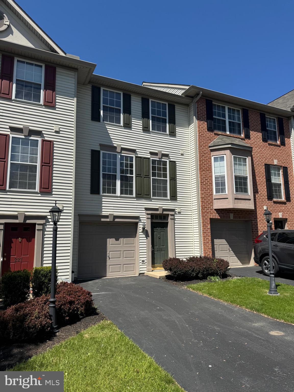 Talk about convenience! This 3 BR, 1.5 BA Tyler Harvest condo is super convenient to I-83, Queen St exit, making it perfect for commuters of all areas. Move-in condition with new paint and carpet! Features over 1700 sq ft of living space with a finished walk-out 1st level with family rm, 1-car garage, patio, deck & more. Community park with sport fields, BBall court, playground & pavilion.