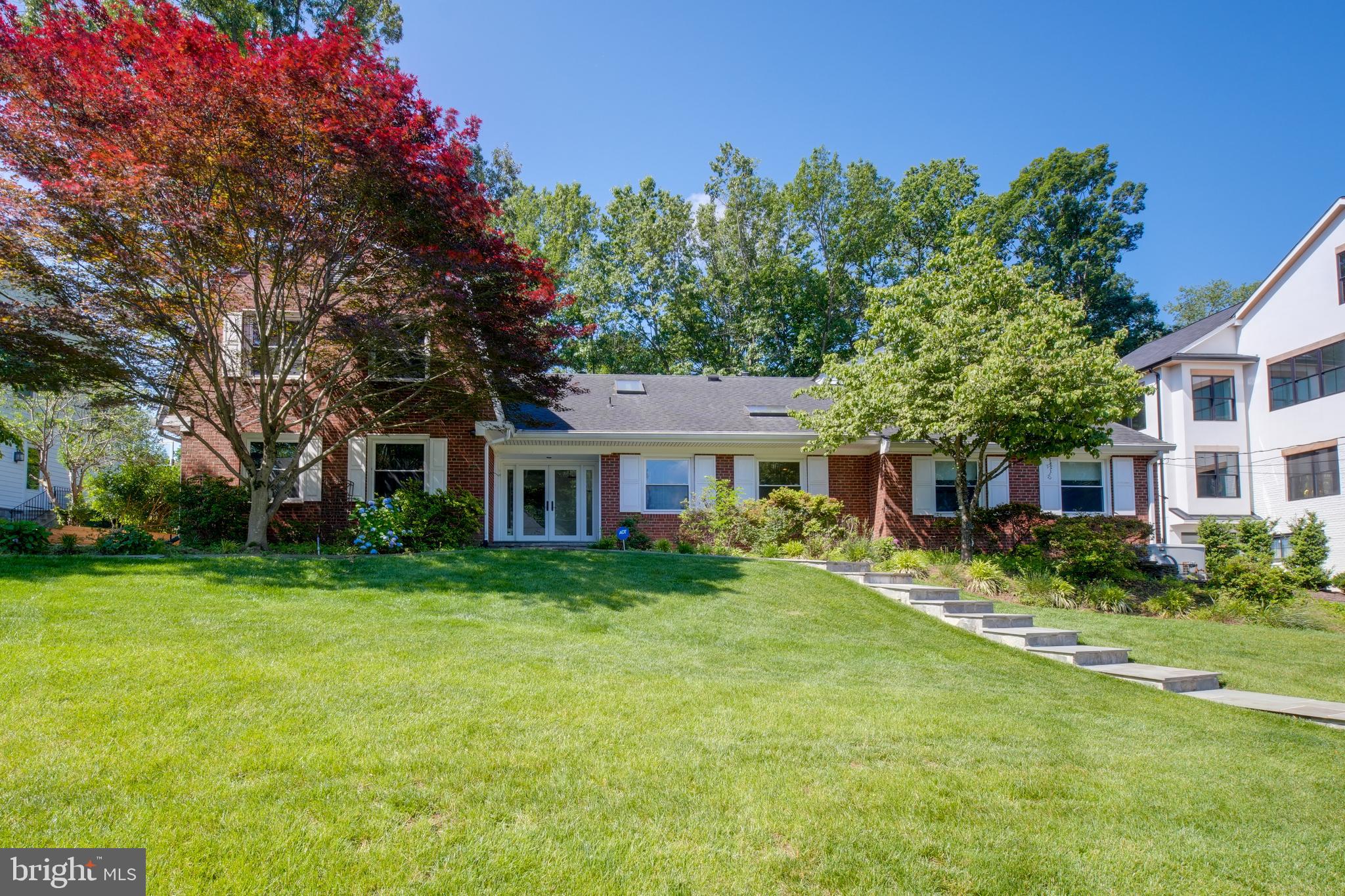 Now available for lease! Also available to purchase! This beautifully landscaped brick Colonial offers two spacious levels of thoughtfully designed living, combining timeless charm with everyday comfort. From the lush green lawn and vibrant Japanese Maple to the stone walkways and expansive backyard, the curb appeal is undeniable.
Inside, a dramatic two-story foyer welcomes you with warm hardwood floors, recessed LED lighting, and an abundance of natural light from overhead skylights. The main level features a large bedroom and full bath with a glass-enclosed shower and pocket door, ideal for guests, in-laws, or multi-generational living.
The heart of the home is the updated chef’s kitchen, complete with high-end stainless steel appliances including a Sub-Zero refrigerator, Wolf gas cooktop, Dacor oven, and Miele microwave and dishwasher. Shaker cabinetry and quartz countertops add a fresh, modern touch, while the adjacent family room with fireplace opens directly to the backyard patio, perfect for relaxing or entertaining.
Upstairs, you'll find three well-appointed bedrooms and two full bathrooms. The oversized primary suite boasts dual walk-in closets and a spa-like en-suite with double vanities. The additional bedrooms share a spacious Jack-and-Jill bath with double sinks and a tub. Ceiling fans and generous storage throughout enhance daily living.
Outdoors, enjoy a private backyard retreat with a stone patio, garden beds, and multiple seating areas for outdoor dining or soaking up the sun. A side-loading two-car garage completes this exceptional rental offering.