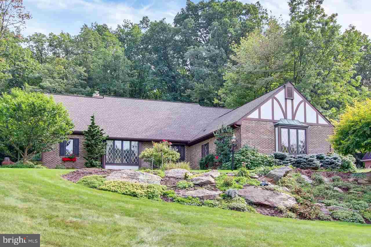 Beautiful 1 owner custom brick home with a contemporary floor plan that features a 1st floor MBR and open cathedral ceiling in the Great Room. Spacious cook's kitchen w/ Thermidor wall ovens and cooktop & breakfast rm. Gorgeous nat. woodwork; lots of windows to view the 2 paver patios and terraced landscape. Premier location on cul-de-sac at Rocky Ridge park. See feat. sheet for all the details.