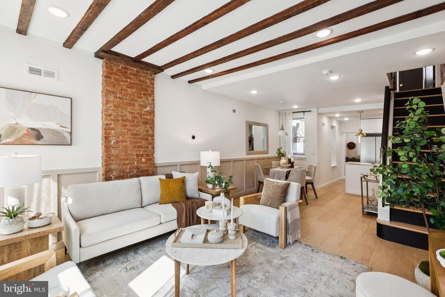 Welcome to 2214 Tulip, a meticulously restored one of a kind brick-front residence boasting a full remodel from top to bottom. In the heart of Fishtown, this home offers 2 spacious bedrooms, 2.5 bathrooms. The inviting living room features an open layout with wide plank white oak hardwood floors, recessed lighting, exposed brick and tons of reclaimed details . The well-appointed gourmet kitchen is equipped with quartz countertops, plenty modern shaker cabinets, a stylish backsplash, and a stainless steel appliance package. Step outside from the kitchen to the mudroom with reclaimed wood and concrete bench and powder room. . Upstairs, the second floor boasts two bedrooms including a primary suite with dual closets and its own ensuite bathroom with large tiled shower and reclaimed wood double vanity. The second bedroom features a deck with views of Konrad Square Park. . In the hallway you will find a second full bathroom with a tub with tiled surround and a washer and dryer closet. All new HVAC, plumbing, windows, electric, and roof! Shows beautifully!