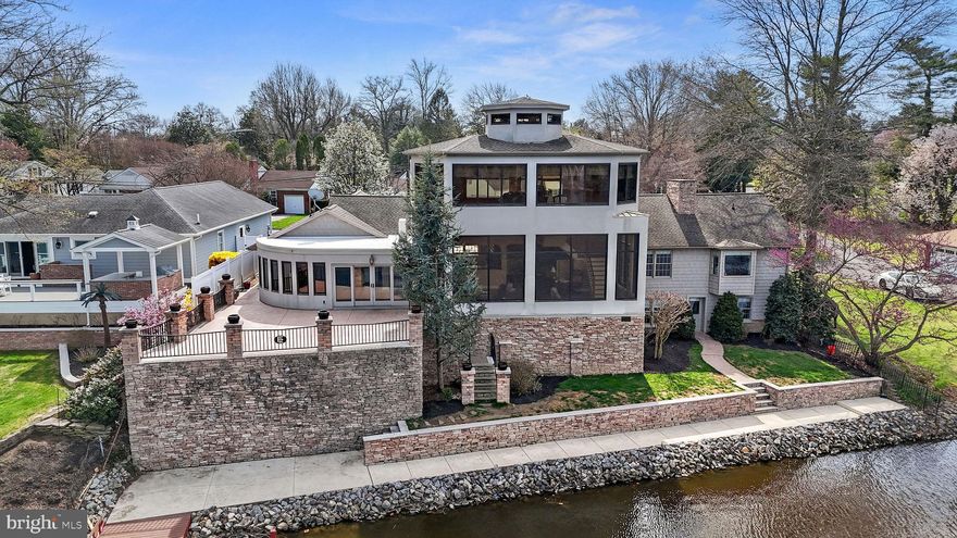 One of a kind waterfront property on Silver Lake! This stunning property is available just in time to enjoy the spring and summer activities.  Enter from the circular drive to a formal living room with a gas fireplace. The wide plank floors have just been refinished throughout the entire home. A custom open kitchen complete with stone counters, built in cabinets and large breakfast area overlooks the massive rear addition. Relax and enjoy the views from the floor to ceiling windows in any of the East rooms of the home. The pub area features another option for a table or seating spot with access to the large, raised patio. From there stairs allow access to the dock. Need to stay indoors? There is a full theater with terraced levels and recliners to enjoy the show! Another unique feature is the second-floor observatory. Use as an office or gathering space as it also has its own wet bar. From there you get one of the best 360-degree views of the Silver Lake area. The finished basement has two bedrooms and another full bath. Additional living space for another seating area with gas fireplace, views to the lake and your own wine tasting room. This property is very special, and it will be difficult to find anything similar to it in Dover.

Water frontage distance is from Kent County mapping and is considered to be an estimate.