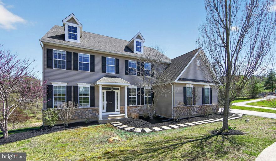 Welcome home to 208 Liberty Circle, nestled in the sought-after Northwoods community. This beautifully renovated four-bedroom, two-and-a-half bath Colonial sits on a lovely lot and is ready for its next owner.  Step inside to a bright two-story foyer that opens to a formal living room- perfect as a home office- and a spacious dining room ideal for entertaining. The heart of the home is the open-concept kitchen and family room, designed for both everyday living and gathering. The eat-in kitchen features granite countertops, stainless steel appliances, abundant cabinetry, and a large island with seating. It flows seamlessly into the inviting family room with a cozy fireplace. Upstairs, the expansive owner’s suite is a true retreat, complete with a tray ceiling, sitting area, large walk-in closet, and a spa-like en-suite bath featuring a soaking tub, custom shower and dual vanity. Three additional bedrooms, a full renovated hall bath, and a convenient second-floor laundry room complete this level. The unfinished walk-out basement offers endless potential for future living space, along with ample storage. Step outside to the deck—perfect for enjoying warm weather and peaceful views of the wooded backdrop. Northwoods residents enjoy community amenities including a tot lot and walking trail, all while being conveniently located near Route 30 for easy access to shopping, dining, and everything Chester County has to offer.
