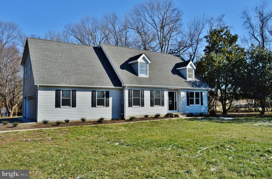 Completely Renovated Cape Cod, 1 acre, private setting, 4 large bedrooms, 2.5 baths, family room off  beautiful kitchen with Island and breakfast area, spacious living room, separate dining room, master bedroom w/ walk-in closet and full bath, new 12x16 deck, 2 car garage and nicely landscaped...