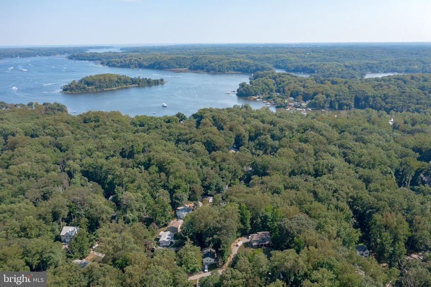 BUILD YOUR DREAM HOME & LIVE THE CHESAPEAKE BAY LIFESTYLE!  Want to live the waterfront lifestyle but spending millions is not an option? You need a lot that is permit approved for septic and ready to go (no guesswork) in a wonderful water privileged community.  This is that property!  Build a beautiful 2,500 square foot home down the street from the highly sought after Scenic Severn River and the Chesapeake Bay boating lifestyle will be yours.  The renderings featured are for informational purposes only to serve as an example of what type of home could be built on the lot.  Enjoy all the amenities of a private club with beach and dock, picnic pavilion, tennis and basketball courts, playground and community center...what else do you need?  Perhaps you are looking for an ideal commuting location?  Look no further as Herald Harbor has quick access to Rt 97 and is an easy trip to Baltimore, Washington and all transportation hubs.  Travel to Historic Downtown Annapolis in 15 minutes by car or boat   unless you are taking a leisurely sail!  The possibilities are endless...this is the lifestyle you have dreamed of and one you can afford! (All plans and permit info attached in MLS documents)