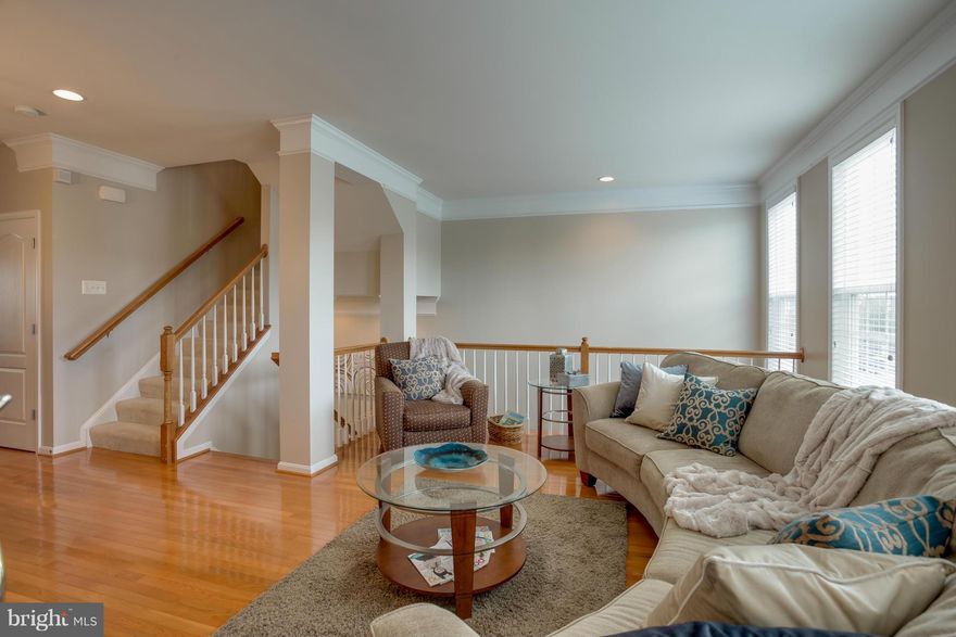 Stunning interior unit TH w/2 car GARAGE. OPEN-CONCEPT-LIVING with TONS of Light & gleaming HW floors throughout main level! Gourmet kitchen w/upgraded appliances, stone/mosaic backsplash, granite counters & loads of cabinetry.SPACIOUS Master suite with walk-in his & her closets, luxury bath w/dual vanities. Finished lower level with W/O basement leads to FENCED back yard. Mins to Rts 50, 28, 15!