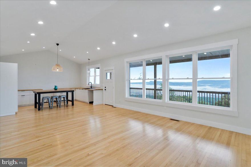 Welcome to your brand new home perched on nearly 6 acres in beautiful Romney, WV. Perfectly situated at the top of the mountain, this property offers breathtaking panoramic views in every direction while still being just a short drive to town.
Step inside to an inviting open floor plan designed for both comfort and entertaining.  The home offers plenty of natural light, windows on all sides  showcase the stunning scenery all year round. The spacious kitchen flows seamlessly into the living area, creating the perfect gathering space.
Relax and unwind on the covered deck, where you can enjoy morning coffee, evening sunsets, and everything in between. With just under 6 acres, you’ll have room to roam, garden, or simply enjoy the peace and privacy that mountain living provides. Spacious unfinished basement offers plenty of storage or space to finish and turn into your own
Whether you’re looking for a full-time residence or a weekend retreat, this home offers the best of both worlds—serenity at the top of the mountain and convenience close to town.
Don’t miss the chance to make this brand new home with unbeatable views your own!