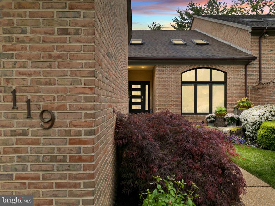 Tucked within the coveted Fairthorne community beneath a canopy of mature trees, 119 Bellant Circle is
a refined, architectural residence offering modern comfort and move-in-ready ease.
A walled garden walkway leads to the entrance, where a dramatic two-story foyer opens into a light-filled
gallery interior. Skylights and a sculptural open staircase bring natural light throughout the home, while
handcrafted Venetian plaster walls add warmth, texture, and a level of finish rarely found at this price
point.
The floor plan is intuitive and highly livable. Main-level living is anchored by a spacious primary suite with
a walk-in closet and private bath. Vaulted ceilings define the living room, while the dining room offers a
more intimate setting. Bleached oak hardwood floors run throughout the main living areas, creating
warmth and continuity.
The kitchen opens into a den centered around a floor-to-ceiling brick fireplace converted to gas. Sliding
glass doors extend the home outdoors to a private deck and paved terrace surrounded by mature
landscaping.
Upstairs, three additional bedrooms and an open loft provide flexibility for guests, work-from-home living,
or creative use. One bedroom features a private balcony, while another has been transformed into a
custom dressing room and wardrobe space. The unfinished basement offers substantial additional
potential.
Modern systems and smart home integration include:
 Lutron HomeWorks lighting system
 Carrier smart thermostat
 Vector Security system with cameras, sensors, and garage door control
 Smartphone-connected washer and dryer
 Integrated smartphone control throughout the home
Additional enhancements include a Generac generator, updated powder room, new front door, and
numerous thoughtful upgrades.
Located minutes from Greenville, the property offers immediate access to Wegmans at Barley Mill Plaza,
along with premier dining, cafés, and boutique retail.
Fairthorne is designated a Gold Tree Friendly Community by the Delaware Forest Service Urban &
Community Forestry Program in partnership with the Delaware Community Forestry Council, and is also
recognized as a Certified Wildlife Habitat by both the National Wildlife Federation and Delaware Nature
Society.
More than half of Fairthorne’s 34 acres remain preserved in their natural state, creating a peaceful
landscape of mature trees, winding paths, and native wildlife.
A rare opportunity to own a home combining architectural character, modern systems, and an
extraordinary natural setting within one of Greenville’s most distinctive communities.