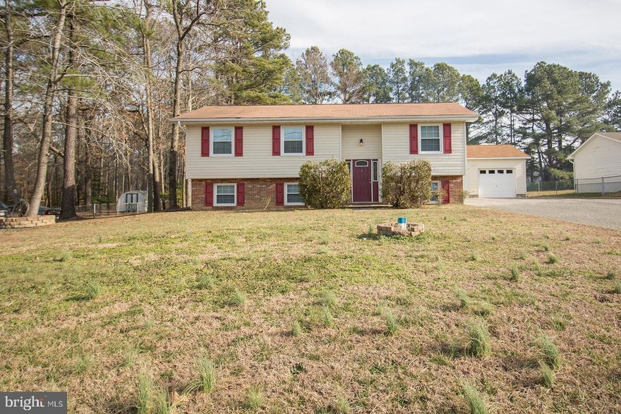 Very well maintained home with easy access to all of St Mary's.  Home sits on 1/2 acre with a detached  2 car garage and three sheds for all of your storage needs.  Home has 4 bedrooms and 2 full baths, two finished areas in lower level that are perfect form home office.  Baths have been updated along with kitchen.  Nice flat lot. Pets on a case by case basis