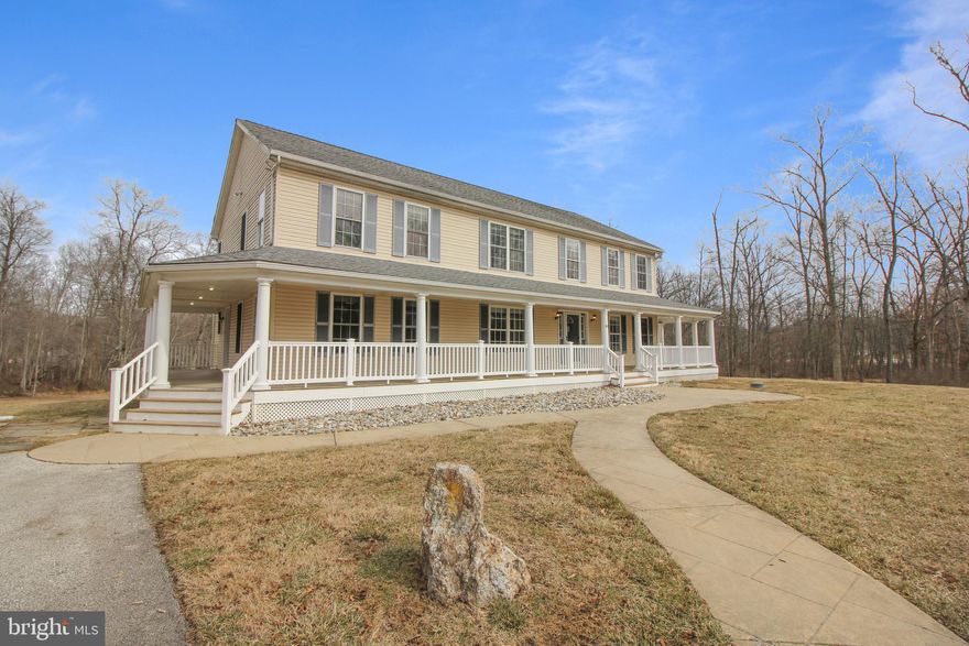 A beautiful, spacious, bright and welcoming home not to be missed. This two story 4bedroom 2.5bath Colonial offers an amazing wrap-around front porch to entice you inside.  With just over 3100 SqFt and sitting on 3.7 acres, the possibilities are endless. Bring your design ideas!  The main level features hardwood flooring, recessed lighting, crown molding and so much more. The kitchen, designed to inspire your culinary adventures offers stainless appliances, center island, spacious pantry, and ample cabinetry for storage and prep. Having an open layout to the family room allows for socializing while cooking. The deck is accessed via slider doors from the family room. Laundry room with sink is on the main level as well as a half bath.  All bedrooms are carpeted and are located upstairs for privacy. The primary suite offers a large closet with built-ins, plus an ensuite bath with stall shower, soaking tub, and dual vanity. Secondary bedrooms share a full bath with tub shower. Additional living space in the carpeted 28x40 recreation room in the basement. There is also an unfinished space for utilities and room for a workshop. Don't miss your chance to own property in this great neighborhood!