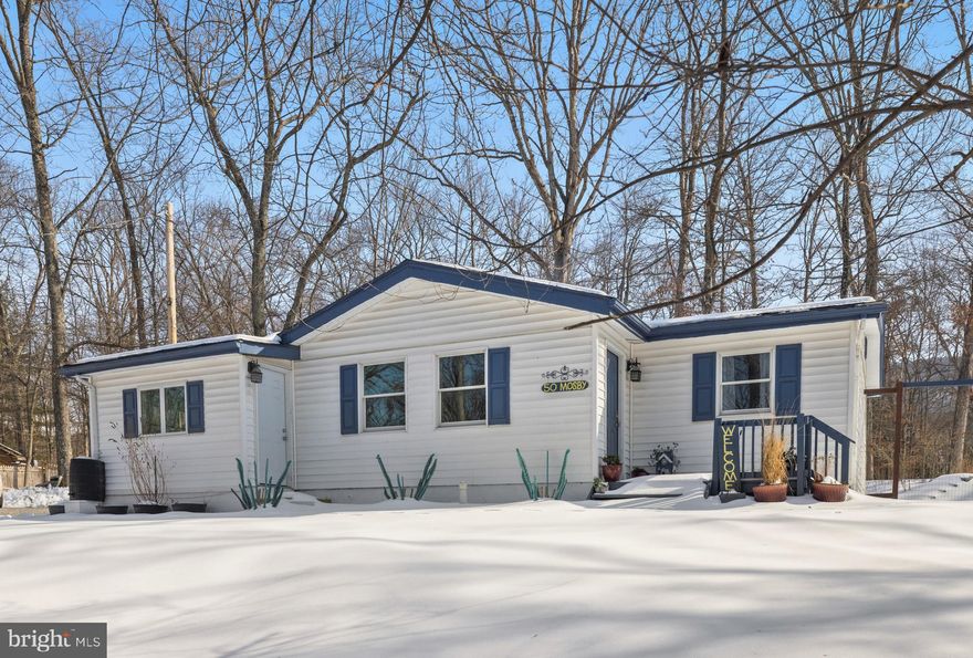 Fabulous 1 Level Living Home on a flat private lot with no hoa! Spacious layout with 3 Bedrooms and 1 Full Bathroom. Large Kitchen with LVP flooring, ample countertop space and  newer Appliances. Separate dining area with natural light flowing through. Family room with vaulted ceilings, stone fireplace, and mantle. The 3 separate bedrooms are nicely designed on the other side of the home providing privacy from the main level areas. Full bathroom has been beautifully renovated! The home also has a Water Treatment System. The grounds of the property are Beautiful, Extensive, and Low maintenance landscaping. Covered patio off kitchen, 10x12 Finished Outbuilding w/ Electricity, Walkways, playground,  star gazing patio, 8ft privacy fence, Private 3/4 acre lot.  High speed internet! Great location to amenities in  Shannondale (Lake Shannondale, Mountain Lake Club, Shenandoah River, John Brown community park, wildlife, and nature trails, etc) as well as convenient to commuter routes, necessities, and amenities!