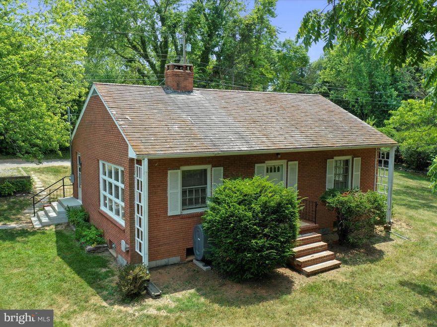 Previous buyer financing fell through due to no fault of seller or house.  Seller is original owner. 1958 City Gem!  This home was built by it's current owner and 1958 and has NEVER been sold previously.  Home has two lots and it pushed all the way over making the lot to the left from Brownville Rd potentially buildable with city approval.  This home has been meticulously maintained.  There is an asbestos roof that has stood the test of time year after year without a single leak.  All wood floors are flawless and kitchen speaks of days of past.  This home is classy and cozy.  Finish the lower level for optimum space and double your square footage.  A lot of work has gone into preparing this home for sale with a new porch with railing on the side, upgraded electrical, painting, and more.  The home faces Morrison St. and backs to Brownville, but there is no access from Morrison.  The community pool is just two blocks away and you are one block from the city park.  Walk to farmers market, Charles Town restaurants, parades, and more in just 4 blocks.  Great in town home!