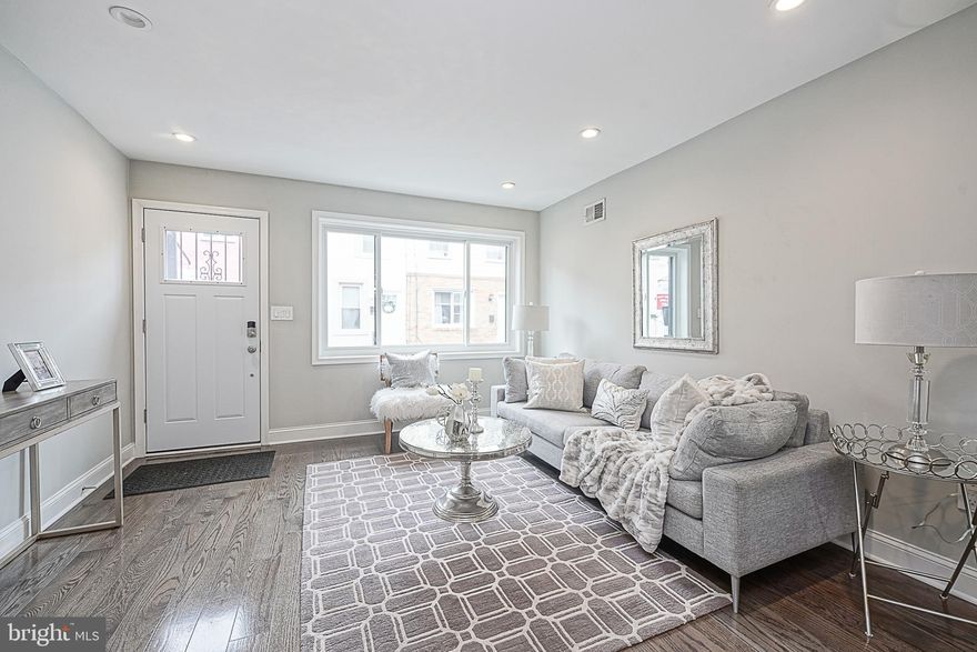 Located steps from Passyunk Square, Moyamensing, Dickinson Square, and the incredible Bok Bar facility, this renovated home provides a comfortable, modern living space with a perfect touch of Philadelphia's unique charm. It offers a two-bedroom, one-and-a-half-bathroom layout with an open floor plan. Inside, you'll find hardwood floors throughout and ample natural light, thanks to the large south-facing windows in the living room. The functional kitchen features granite countertops, white shaker-style cabinetry, and a Whirlpool stainless steel appliance package, including a dishwasher and microwave. The extra-spacious back patio, featuring a tall privacy fence, provides ample space for hosting summertime BBQs. The second floor houses the spacious bedrooms and a modern bathroom that includes a vanity, a fully tiled shower, and a large linen closet in addition to the large hallway closet making for plenty of storage space on the second level. The finished basement offers additional living and storage space, along with the home's well-maintained mechanical systems. Included is a Samsung front-load washer and dryer. A basement drainage system and vapor barrier, as well as a new exterior wall, were added a few years ago. This home, nestled in East Passyunk, provides easy access to local parks, shops, dining options, and popular spots like Irwin's Upstairs at Bok Bar and Triangle Tavern; all within walking distance. It's a well-situated, functional home that perfectly complements the vibrant neighborhood.