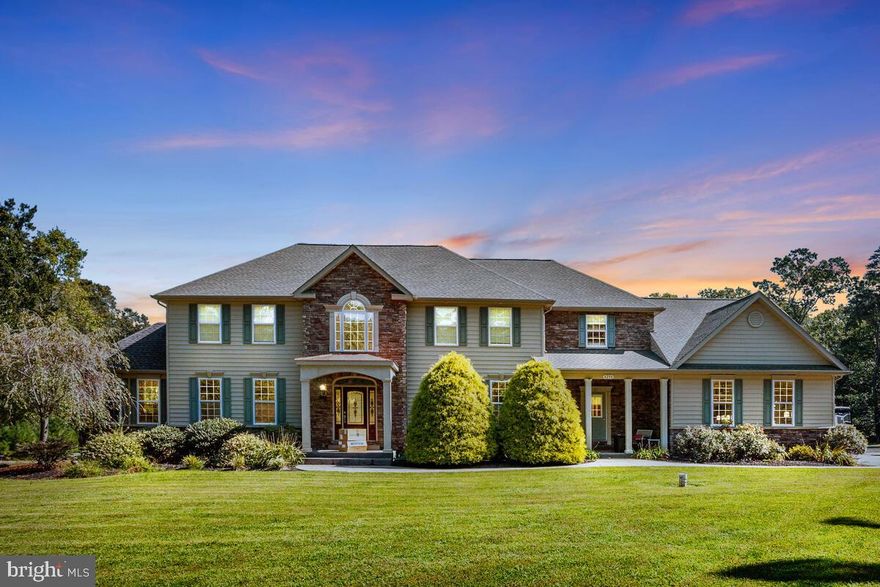 APPRAISED FOR 1.38!!   Welcome to 4250 Hidden Creek Road in Port Republic, where you will live a lifestyle you’ve truly dreamed of! Opportunities like this do not become available often!   This estate style custom colonial home is just shy of 8,000 square feet and is situated at the end of a cul-de-sac on a private home site backing to community space for optimum privacy!  To say this inside of this home is wide open with top notch finishes would truly be an understatement.  Upon entry you will be blown away by the gorgeous light filled two story foyer and a panoramic view of your first floor, which offers Brazilian hardwood flooring, a first floor solarium with serene views, separated by a gas fireplace and formal living room.  The dining room is perfect for large family gatherings and there is a butler’s pantry/bar between the kitchen and dining room! You won’t want to leave your gourmet eat-in kitchen with high end stainless steel appliances, to include a gas cook-top with range hood, oversized center island/breakfast bar, and freshly painted cabinets!  Off the kitchen is massive step-down family room with pellet stove!  The main level also offers a very spacious mud-room with built-in cabinets, ceramic flooring, and separate entry from the front of the home, as well as access to a side load 3 car garage with professionally painted floors!  The upper level offers a private owner’s suite featuring a double door entry to a sitting room, tray ceiling, and leads to a hotel and spa like bathroom with a floor to ceiling oversized ceramic shower with dual shower heads, separate soaking tub, and a walk-in closet with custom built-ins and plenty of natural light!  The additional bedrooms are very spacious and offer a buddy bath and an additional private bath!  The basement has recently been redone and every square inch is perfect!  There is a fully second kitchen in the basement, a MASSIVE rec room, additional bedrooms, storage, full remodeled bath, new flooring throughout, and has been freshly painted!  The basement also has a wide staircase that leads directly to the back entertaining area!  The home also includes ample recessed lighting, chair railing, crown molding, and high ceilings! The exterior of this home is the icing on the cake and will scratch every itch from parties and your personal hobbies!  Starting with an inground heated pool and hot tub combo!  The enclosed custom stone pool bar features a cathedral ceiling with fan, hibachi grill, standard grill & sink!  The entire exterior pool space is fenced in and surrounded by beautiful pavers!  Take a short walk to your recently build 5,000 square foot pole barn to store anything imaginable!  PLENTY OF PARKING!  The roof is just a few years old, irrigation system, multiple storage sheds, to name a few extras.  This home and property is truly a playground for all and a place you’ll never want to leave!  Easy commute to D.C., Solomon’s Island, PAX River, Annapolis, and plenty of dining and shopping! Zero turn mower can be sold with the home.  SOLAR IS OWNED AND NOT LEASED!