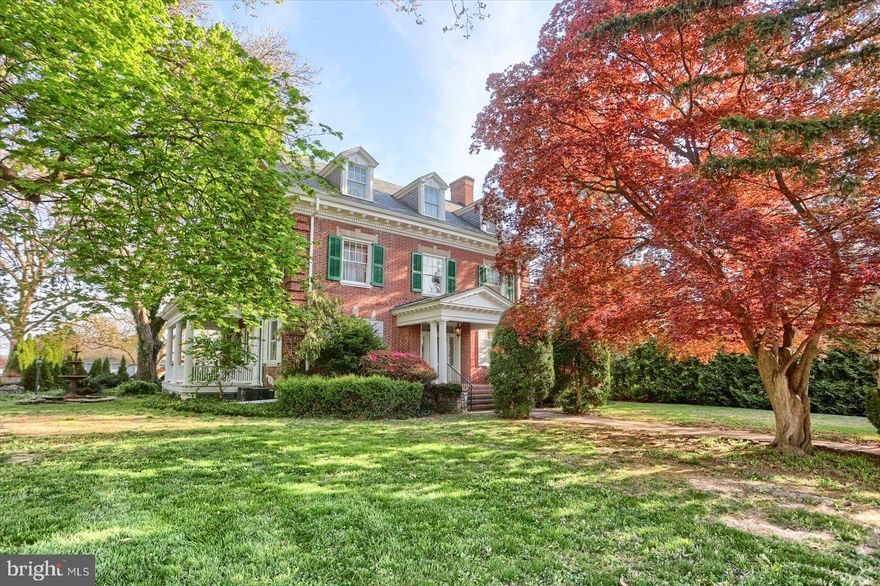 Welcome to the Wayne McFall Mansion built in 1905. This corner-lot-home has everything you would expect in a unique stately property. 201 Elmwood is located near I-83 making it the perfect hub to commute to DC, Baltimore, Lancaster, Gettysburg, and Harrisburg. The drive to Philadelphia is typically under two hours and NYC is three hours away. However, you only need to travel a few minutes to be in downtown York to enjoy art, music, dining, farmer's markets and nightlife. This home has stunning hardwood flooring, unique web windows, a butler pantry, dual staircases, stained glass, a three-season room, pocket-doors, main bathroom suite, two garages (six spaces total), central air, wood fireplace, seven bedrooms and a floorplan/layout that feels straight out of a movie. The third floor has two bedrooms which were used as a game room and a billiard room. In between is a wet-bar with a mini-fridge and a beverage chiller; ideal for entertaining. The basement has been updated with hardy board, there is a laundry room, a wine cellar, and plenty of room for storage. The estate is perfect for gardening, has a flat yard for play, and is situated in a neighborhood known for unique architecture and style. Come tour this home in York Suburban School District. You will not want to leave once you do. This home is charming in every way.