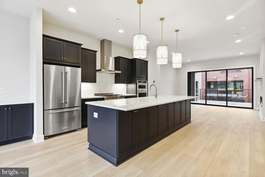 Stunning move-in ready Camelia model home with elevator! Entertaining is made easy with the open main level that offers a spacious dining room, stylish center kitchen, flex room that is the perfect for a home office, and a light-filled great room with gas fireplace that opens to the covered outdoor living space.  The Chef-inspired kitchen features Calacatta Gold quartz countertops, Admiral cabinets, KitchenAid stainless steel appliances, an enormous center island, and warm bronze hardware.  Upstairs boasts a sumptuous primary suite with huge walk-in closet, and a stylish primary bath with quartz countertops and separate soaking tub.  The second level also has two large secondary bedrooms and a laundry room. Upstairs you’ll a rooftop terrace that is the perfect entertainment spot.  The lower level offers an entry level bedroom with sizeable walk-in closet and full bath.  This is one of our final homes at Amalyn – don’t miss your chance to own a home at this highly sough after community.